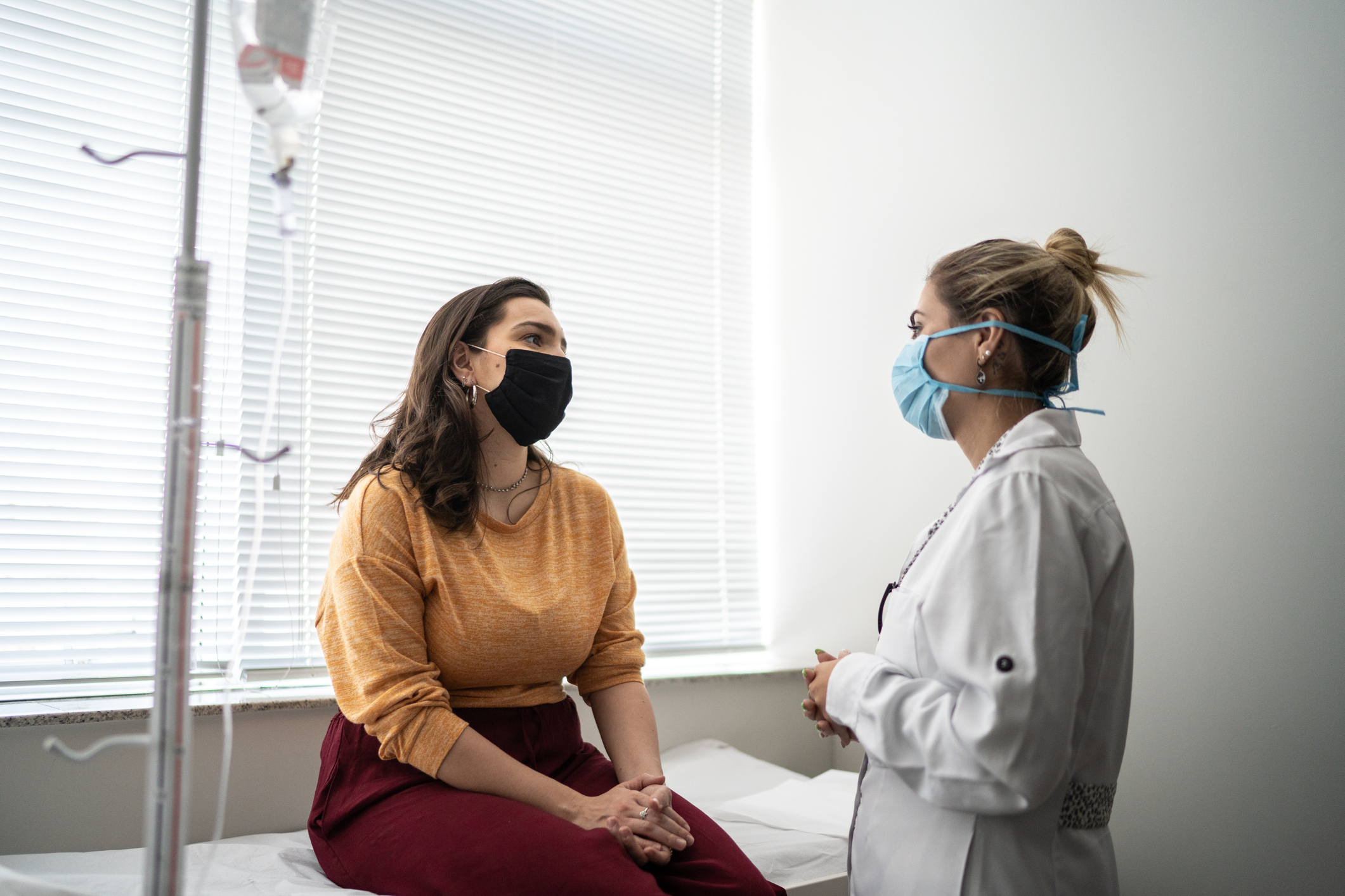 A patient speaks with their doctor at an appointment