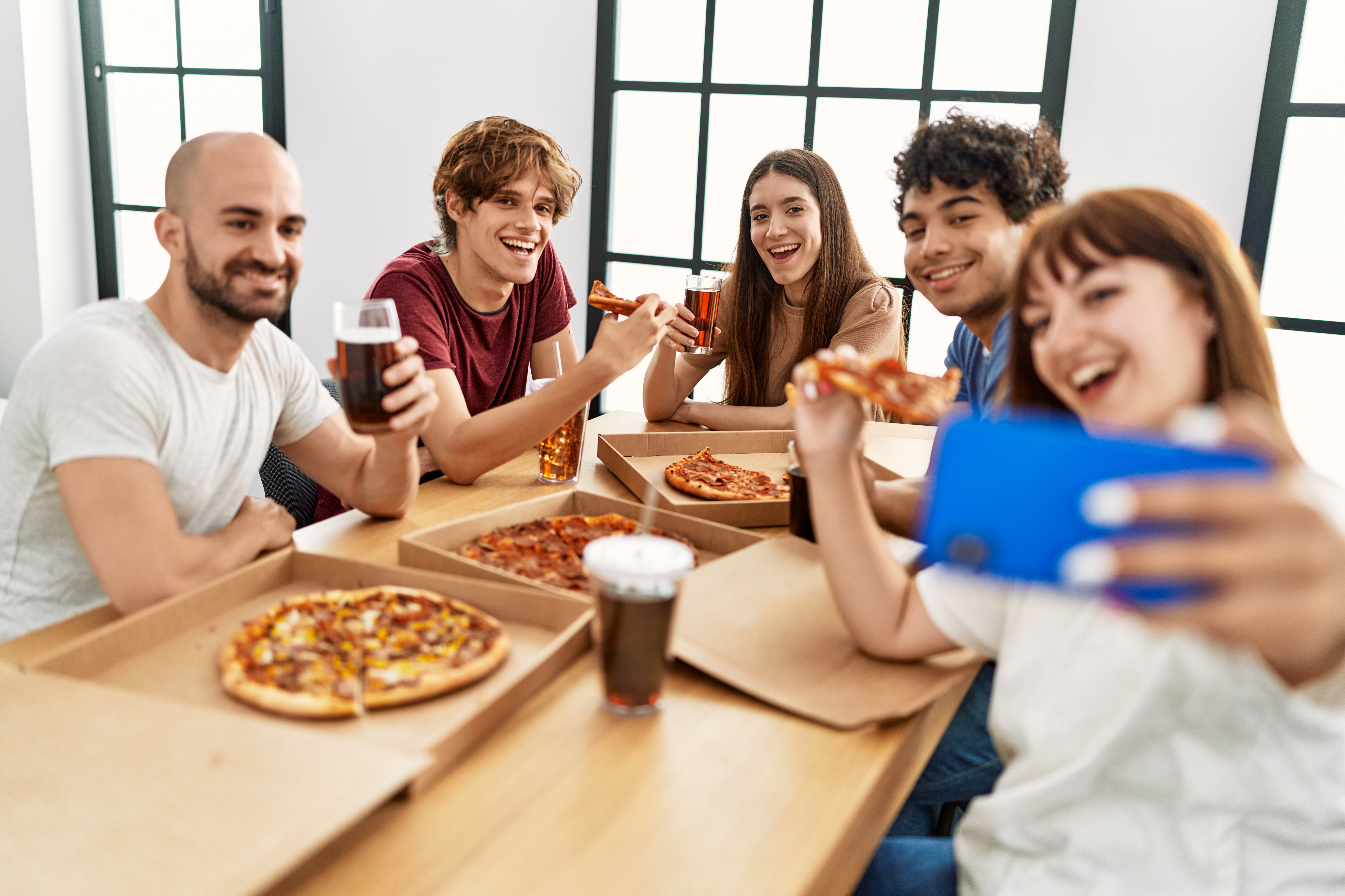 happy friends eating pizza selfie