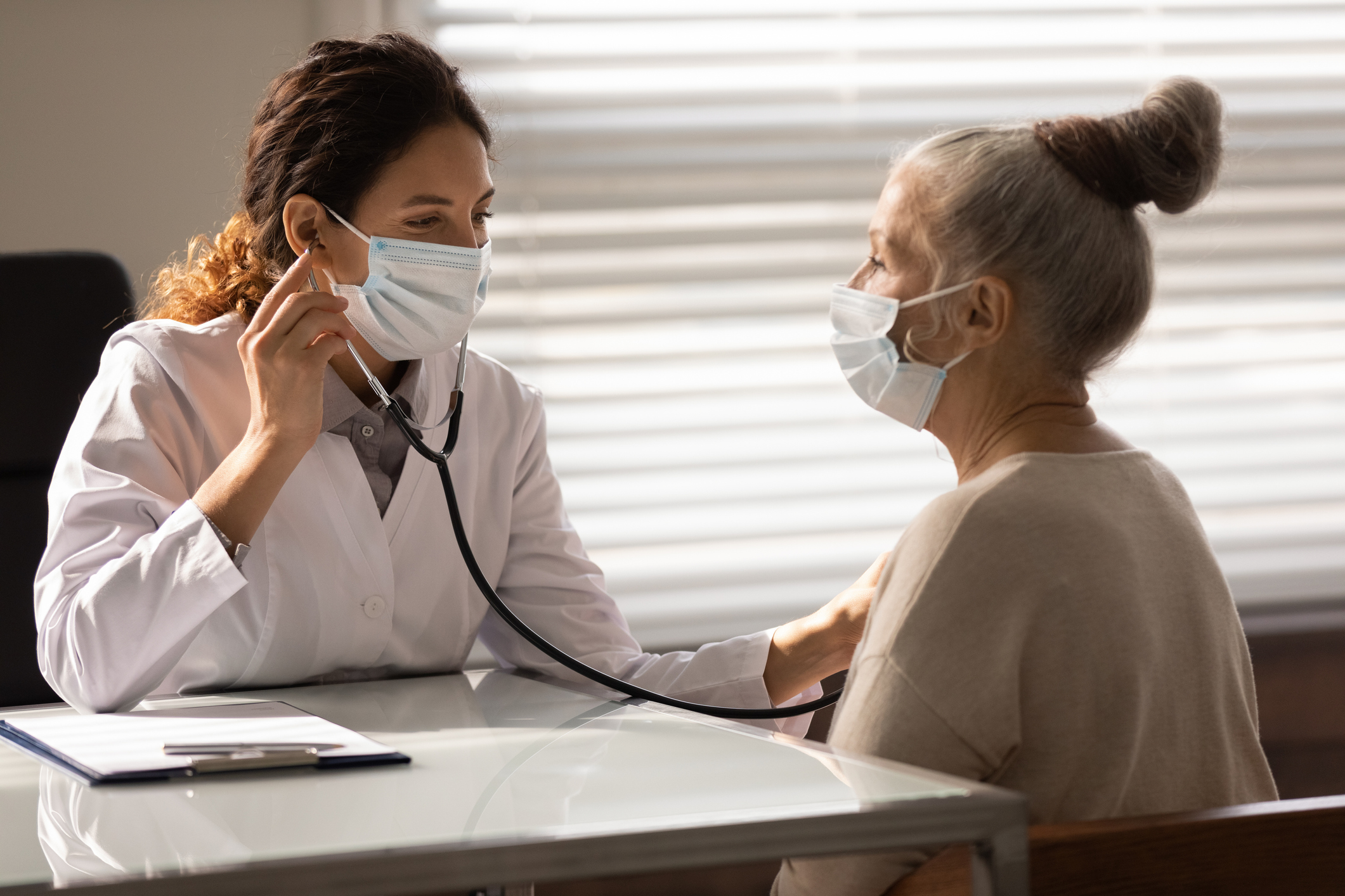 A doctor examines a patient during an appointment