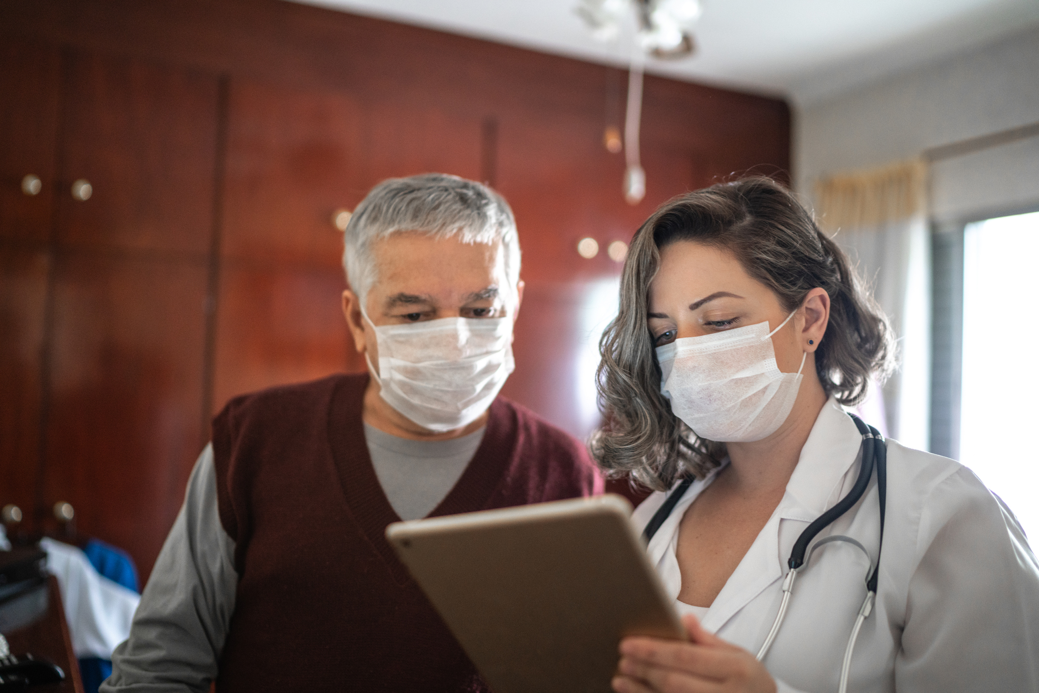 A doctor and patient discuss test results at an appointment