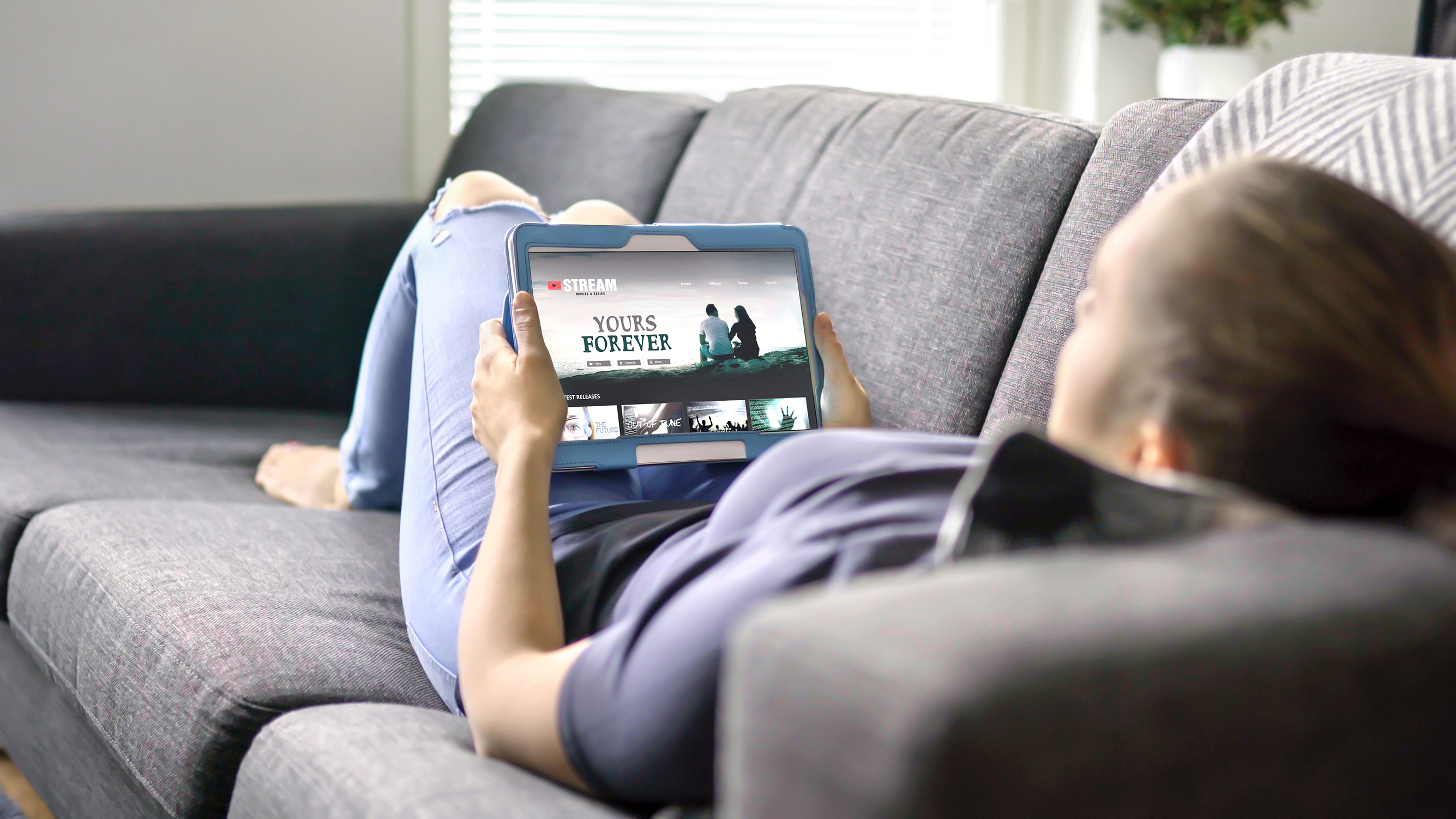 A person streaming on a tablet.