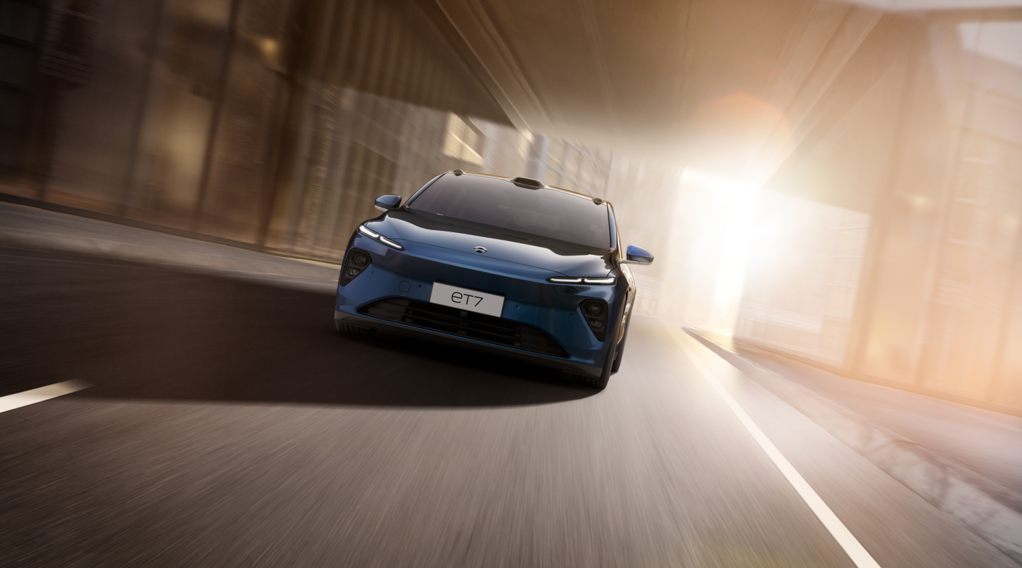 Front view of blue Nio ET7 on the road.
