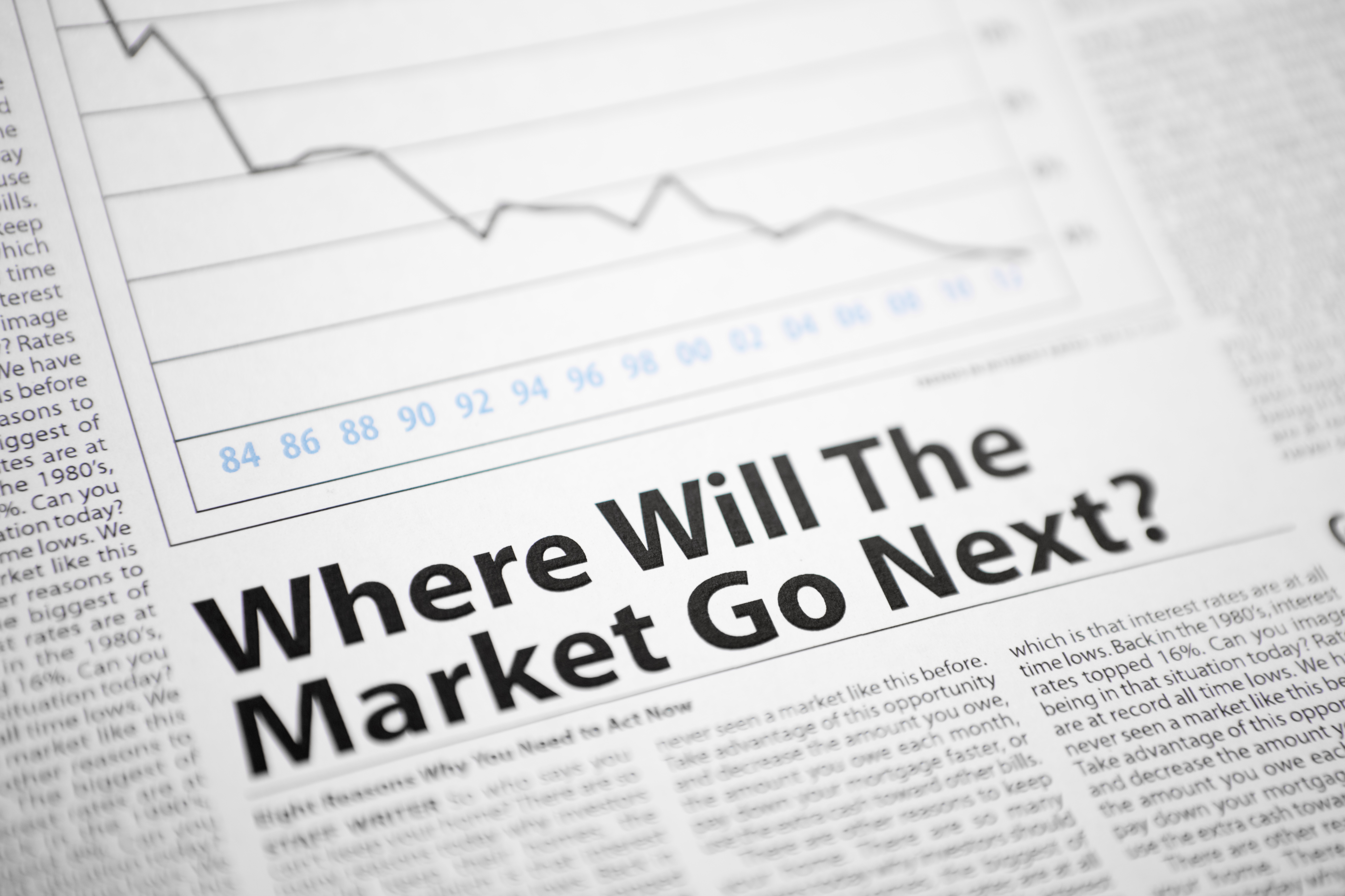 A newspaper article saying: Where Will The Market Go Next? with a graph.