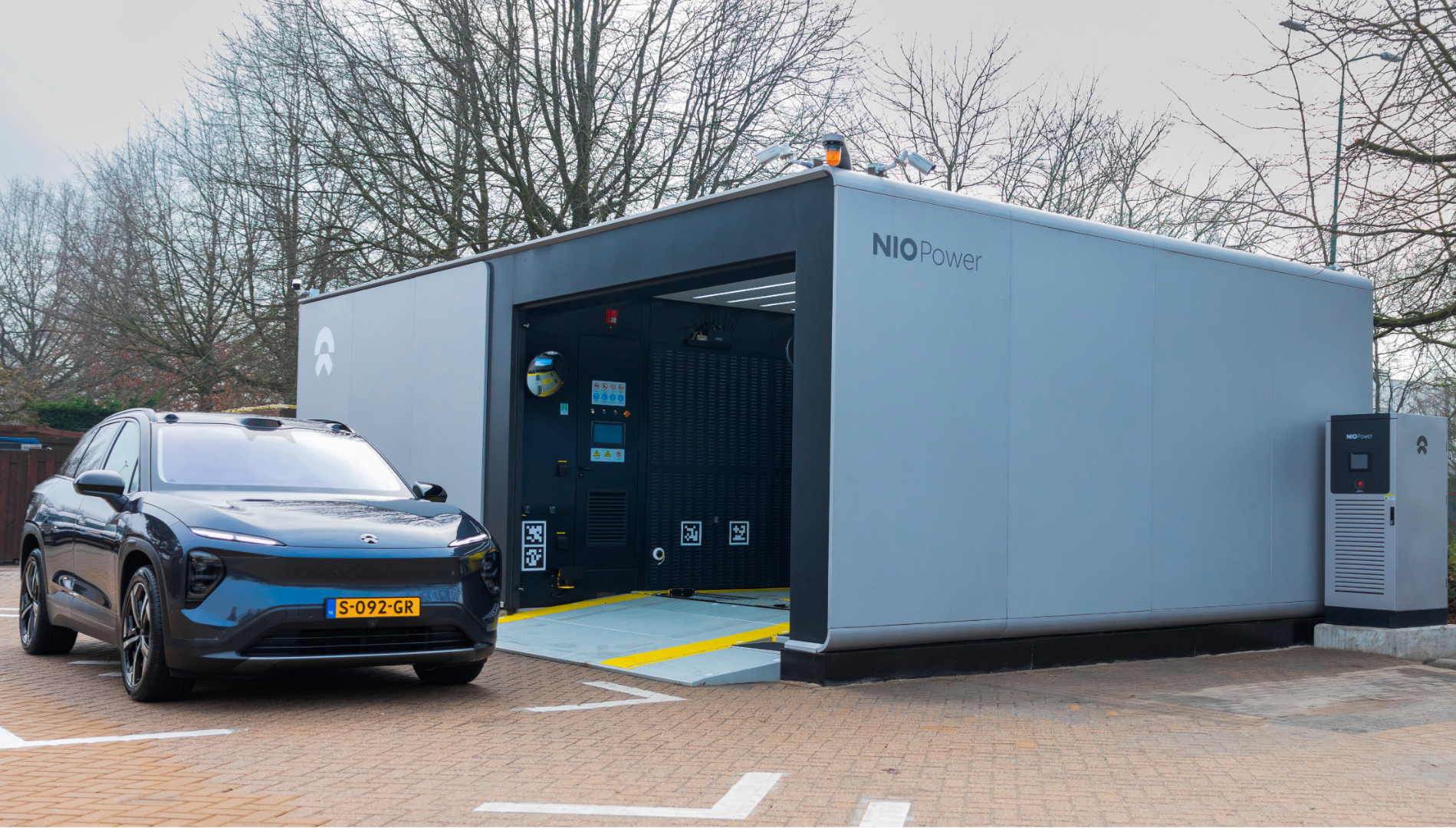 Nio battery swap station with EV in front in Europe.