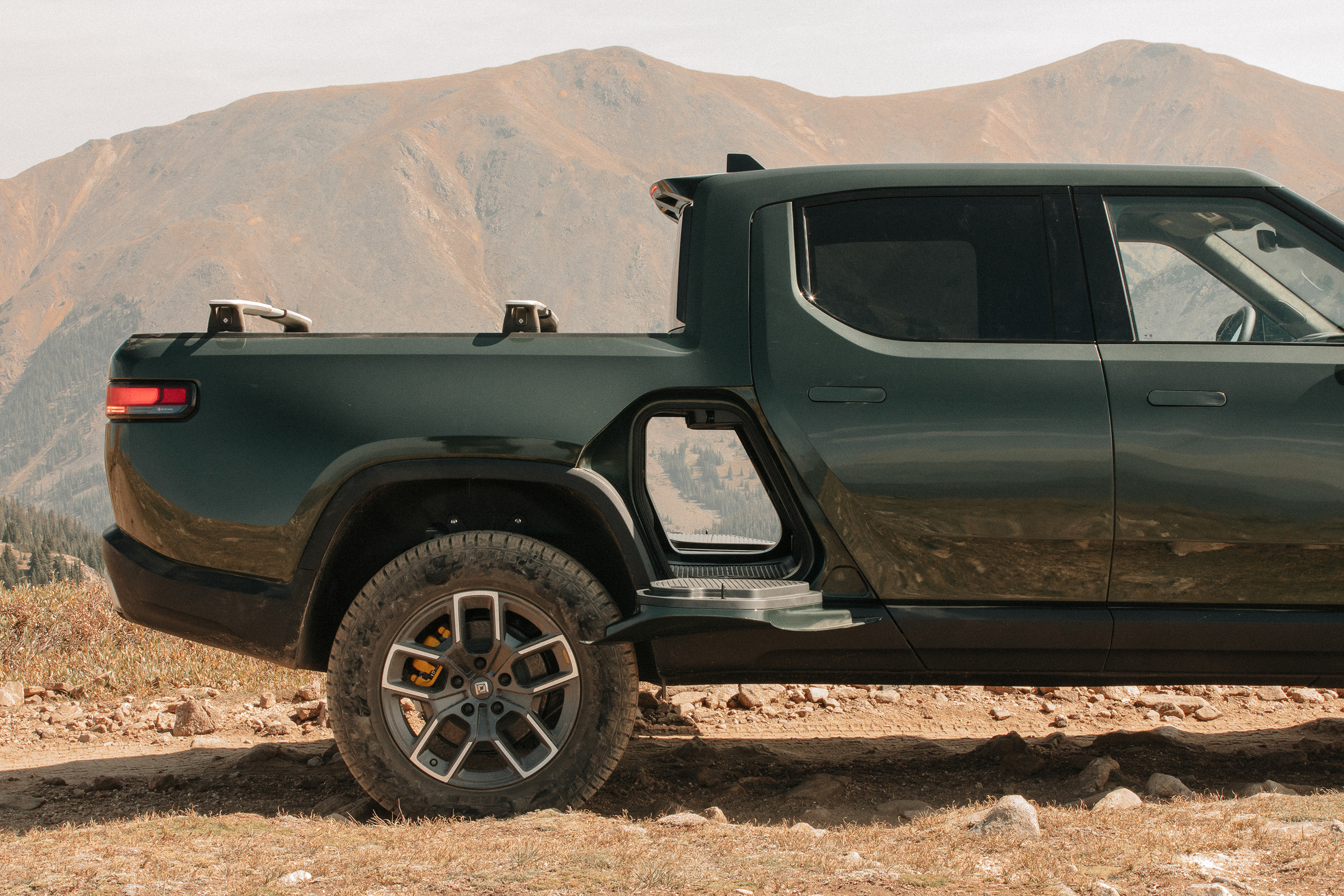Side view of a Rivian R1T electric pickup truck. 