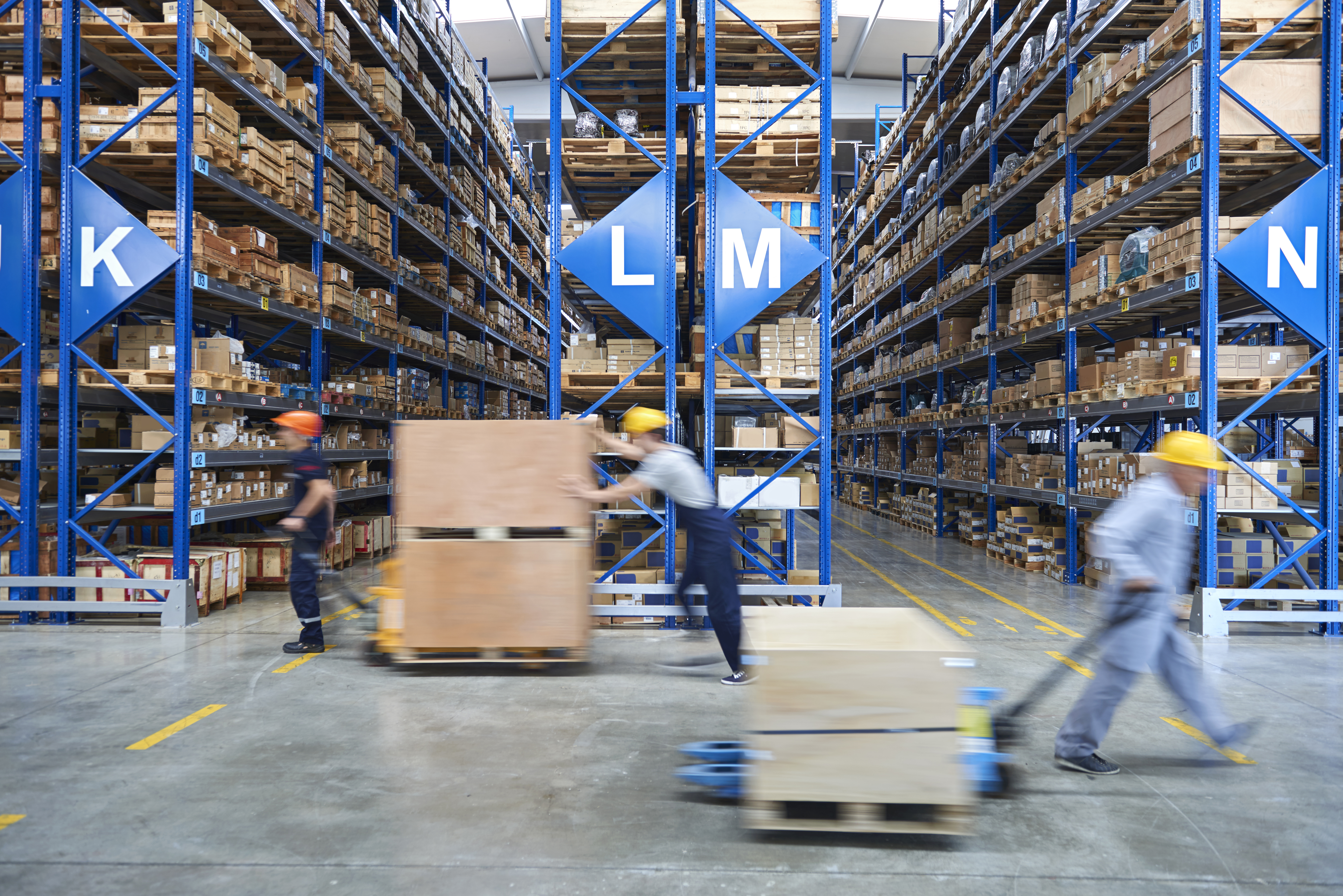 People working in a warehouse.