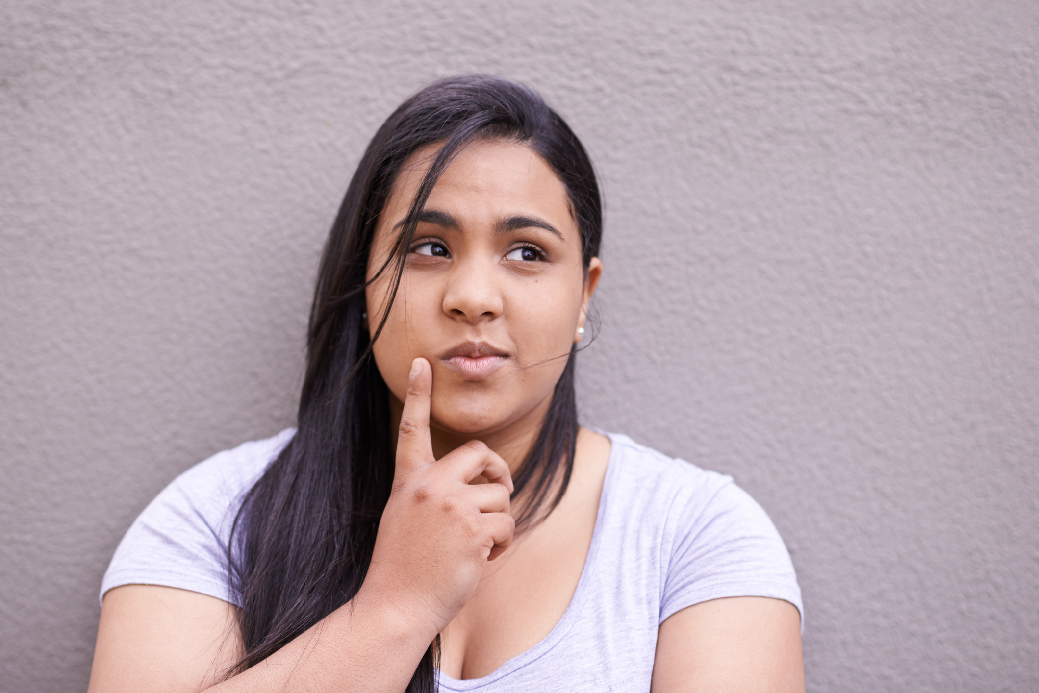 Getty - thinking finger on cheek wondering not sure