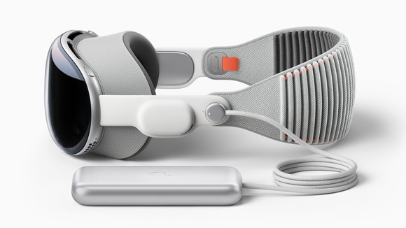 A side view of Apple's Vision Pro mixed-reality headset and wire-connected battery pack. 