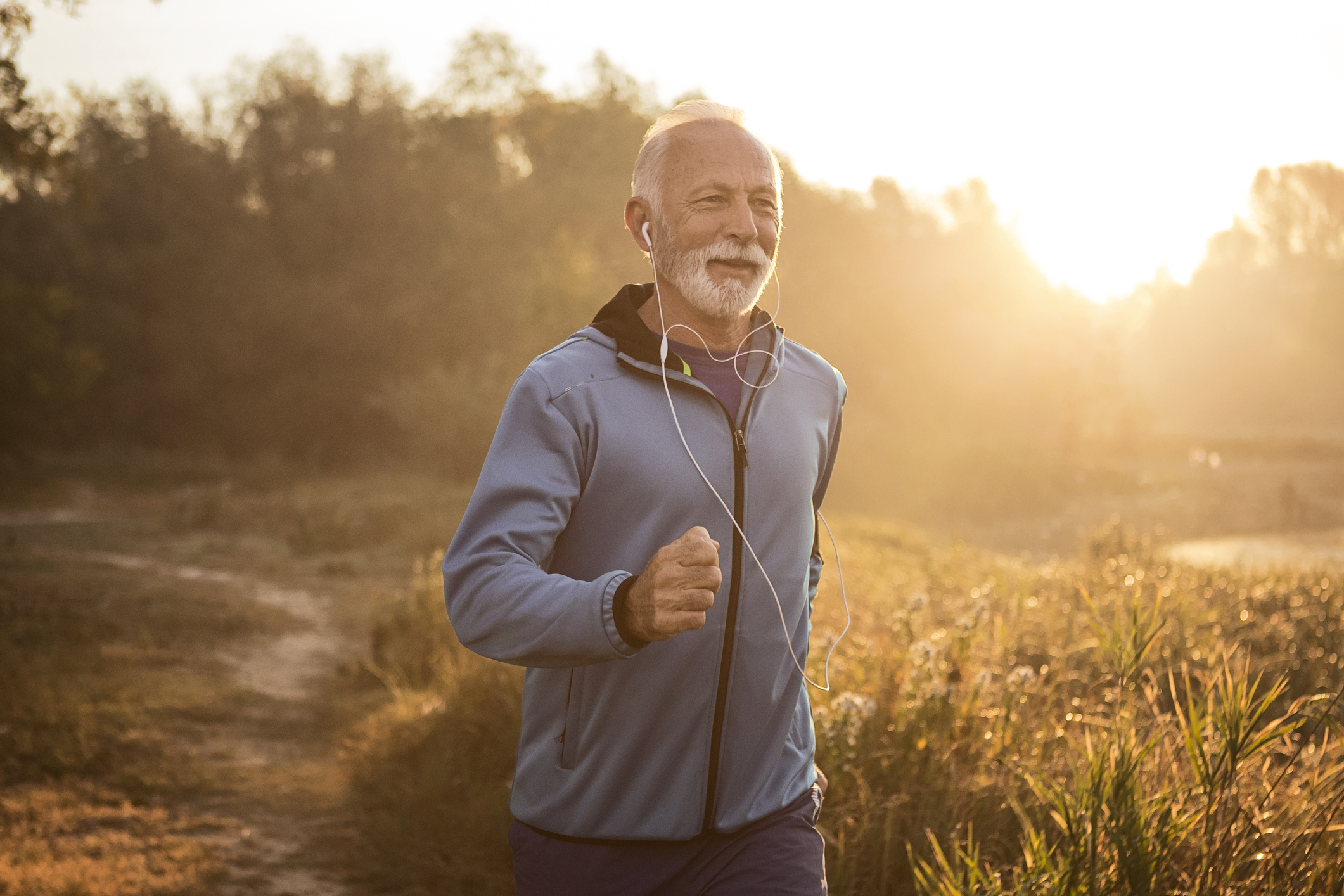 A person outdoors wearing earbuds.