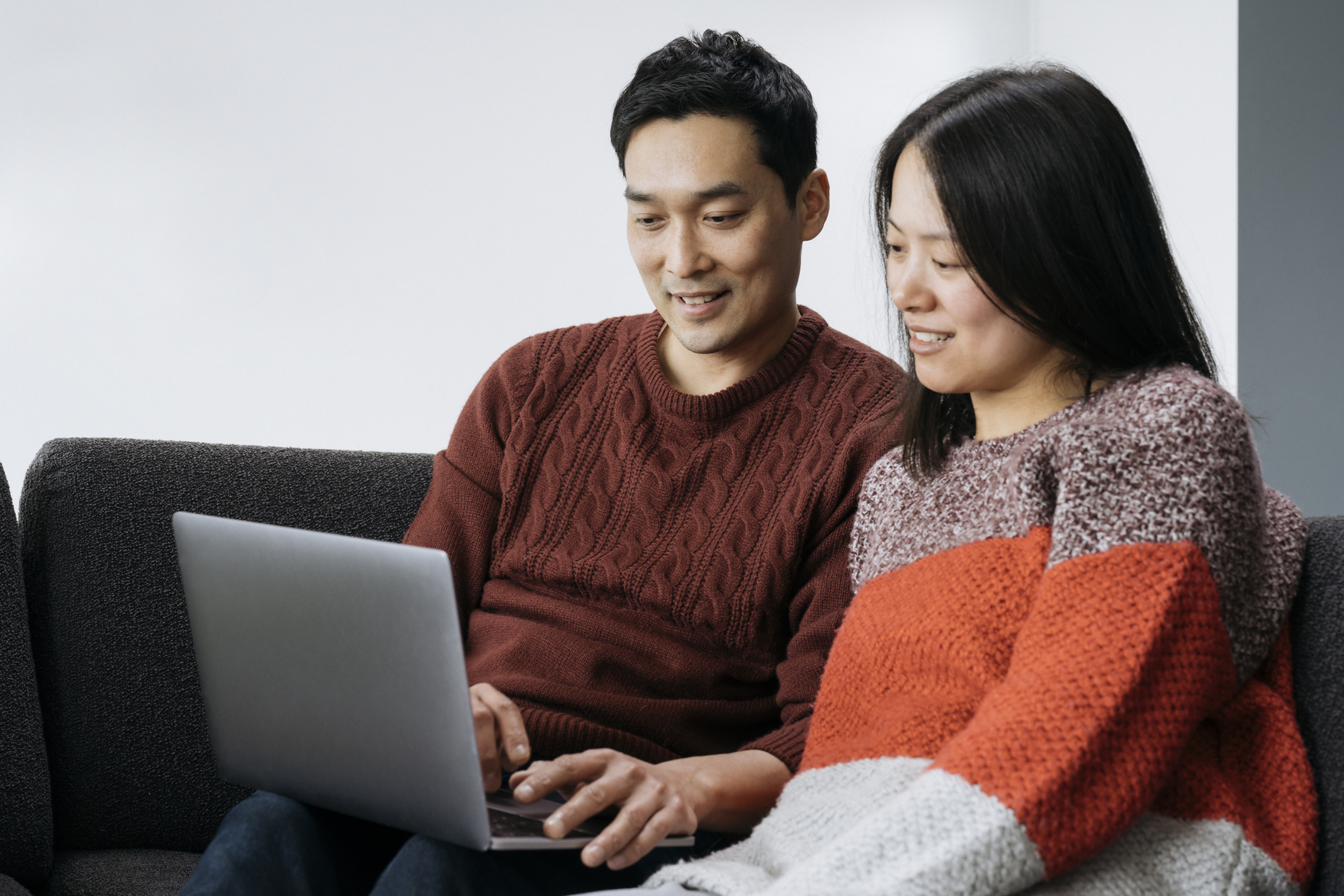 Couple looking at laptop