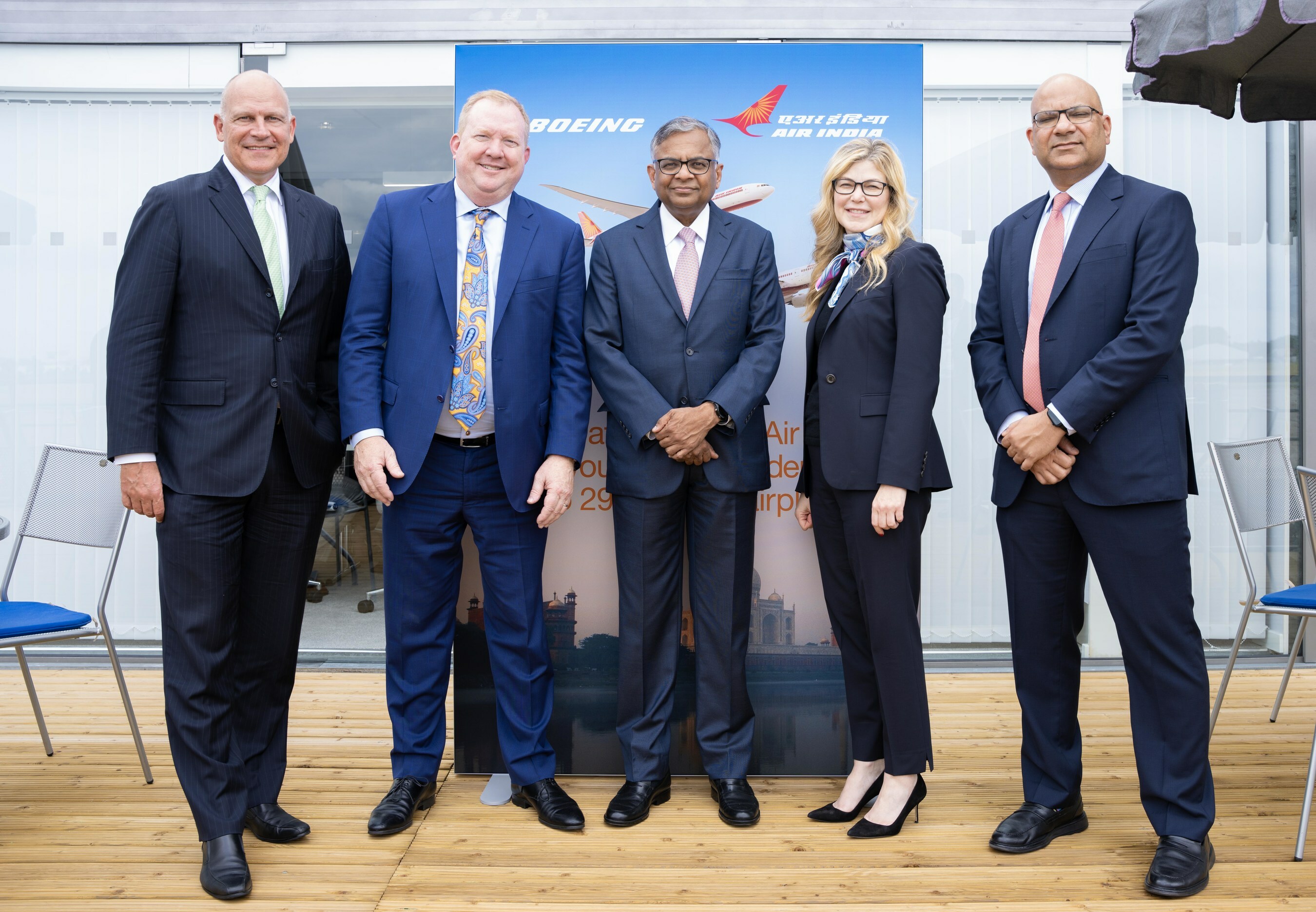 Executives from Boeing and Air India posing for a photo.