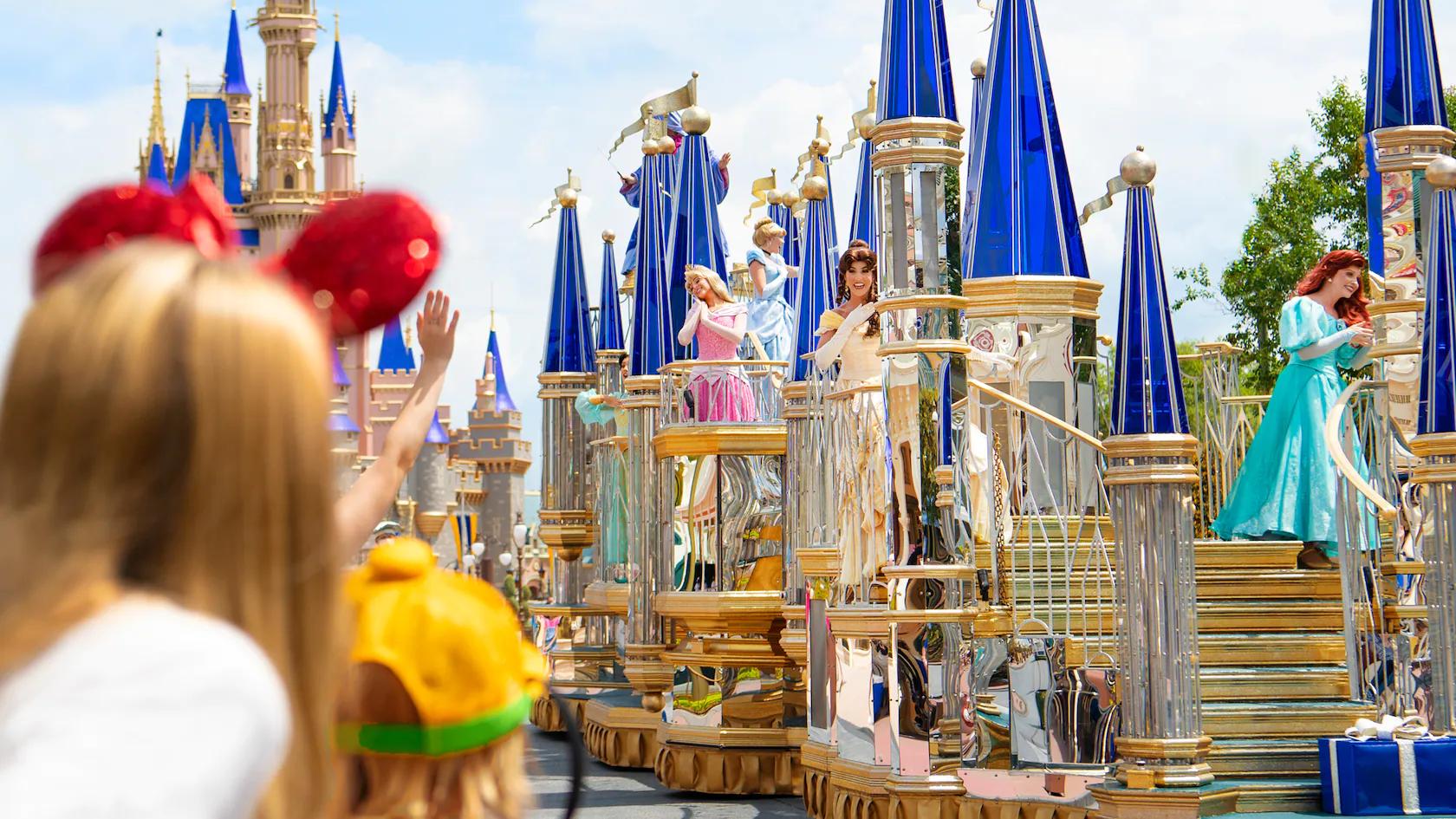 A parade float at Disney World's Magic Kingdom with several iconic princesses on board.