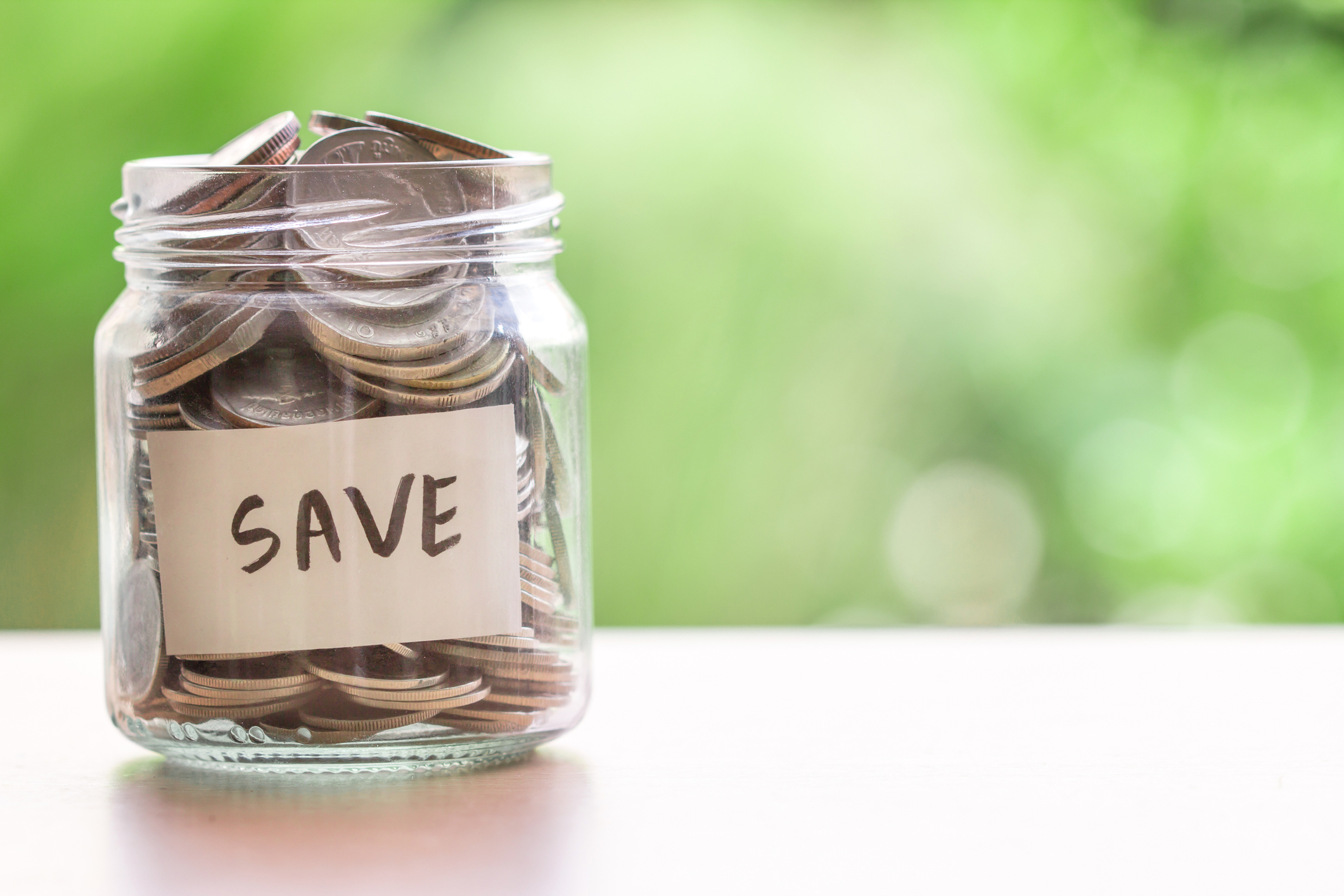 A jar labelled "save" full of coins.