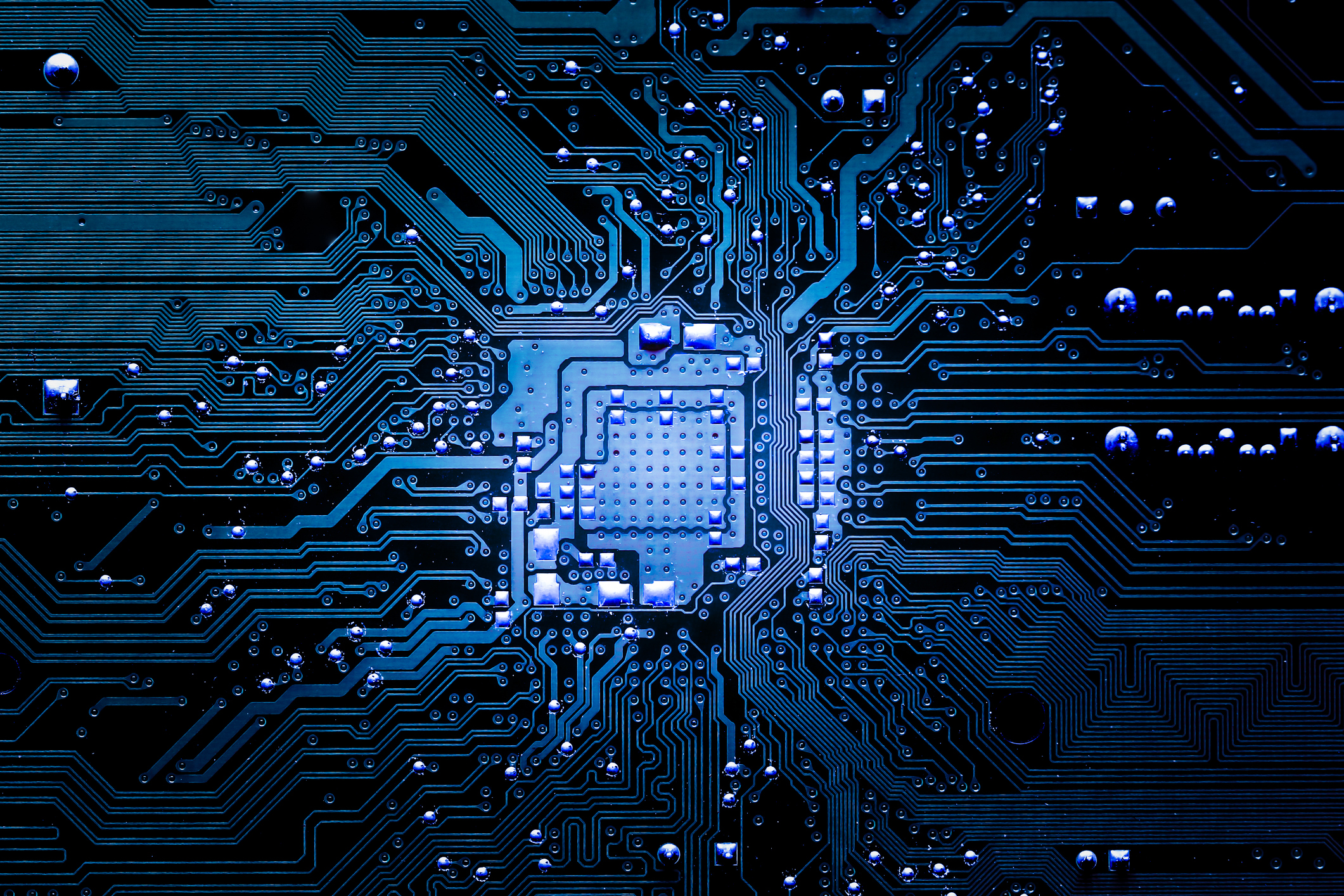 View of square microchip with electronics flowing through.