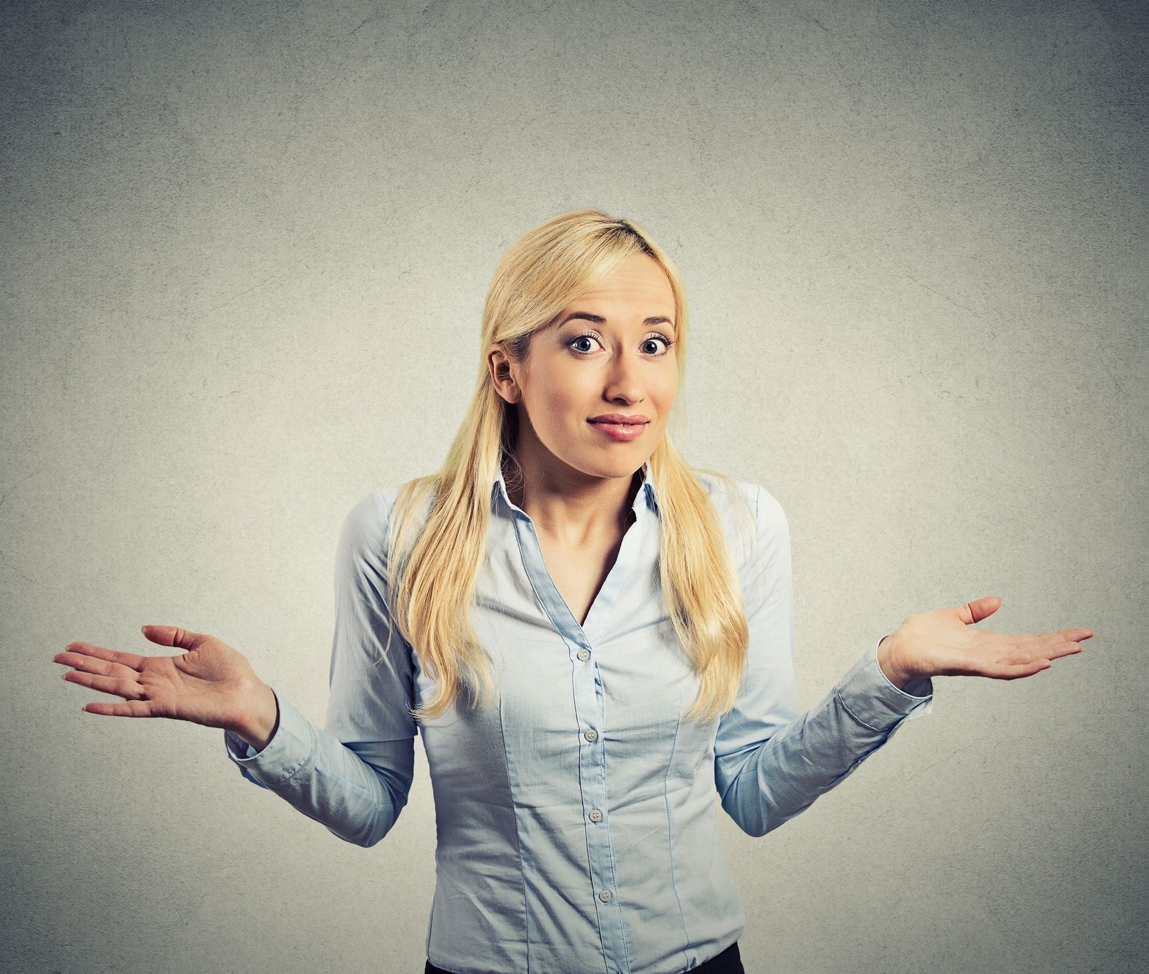 A person holding up their hands in confusion.