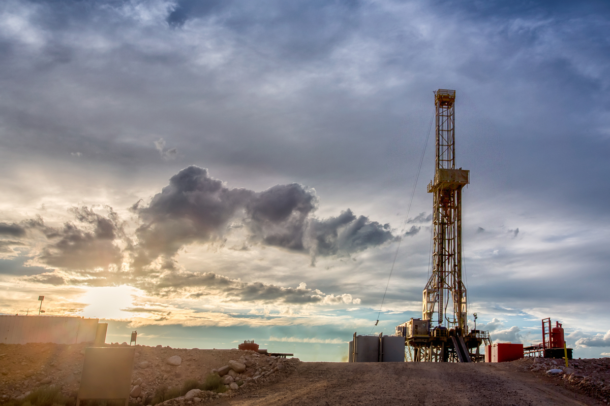 An oil well at sunset.