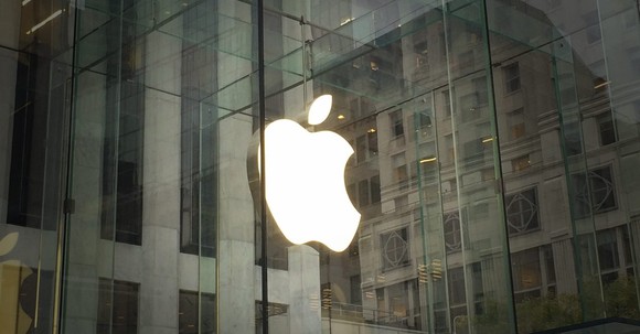 A photo of the Apple logo inside an Apple store.