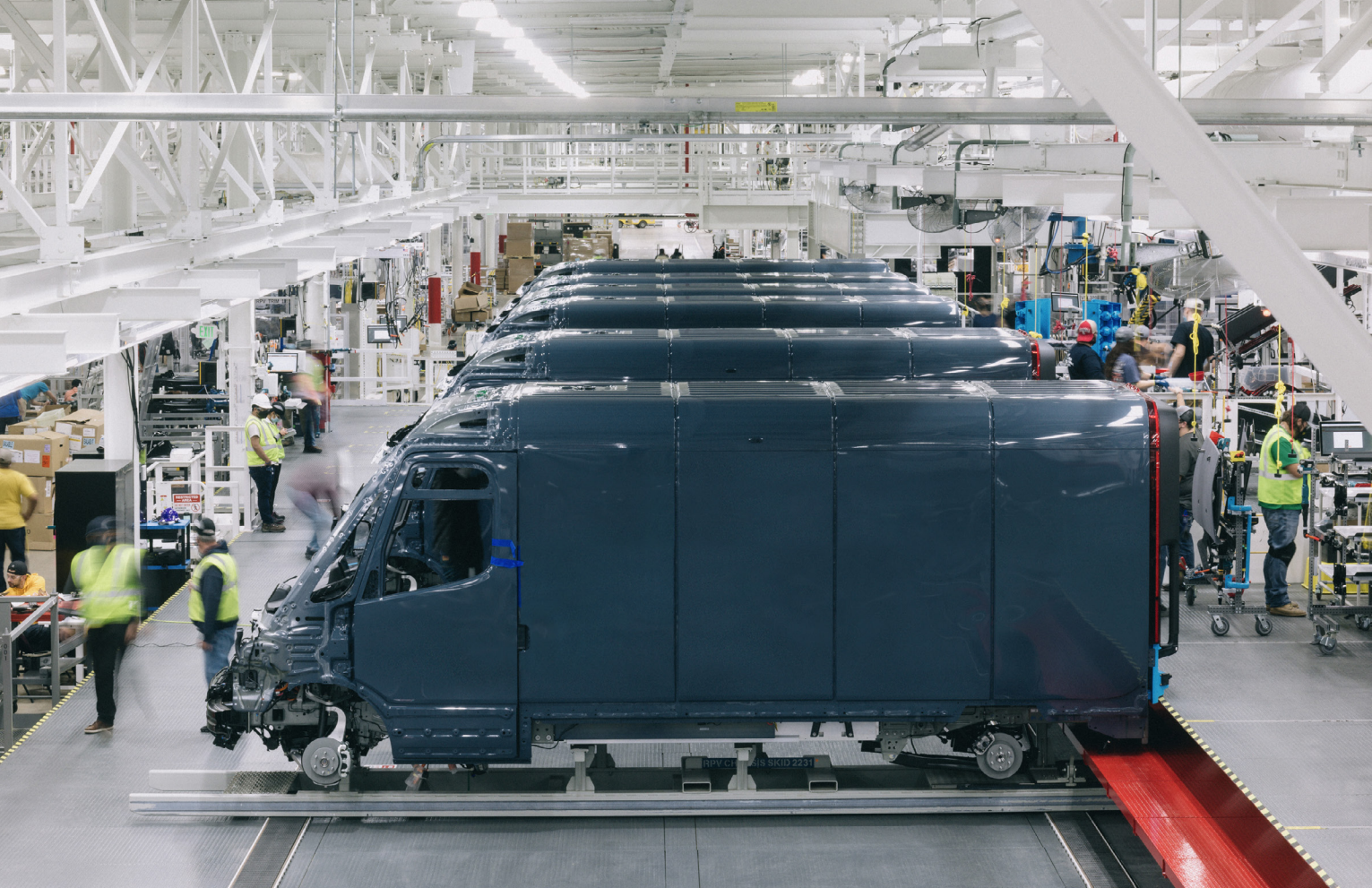 Rivian electric delivery vans in production.