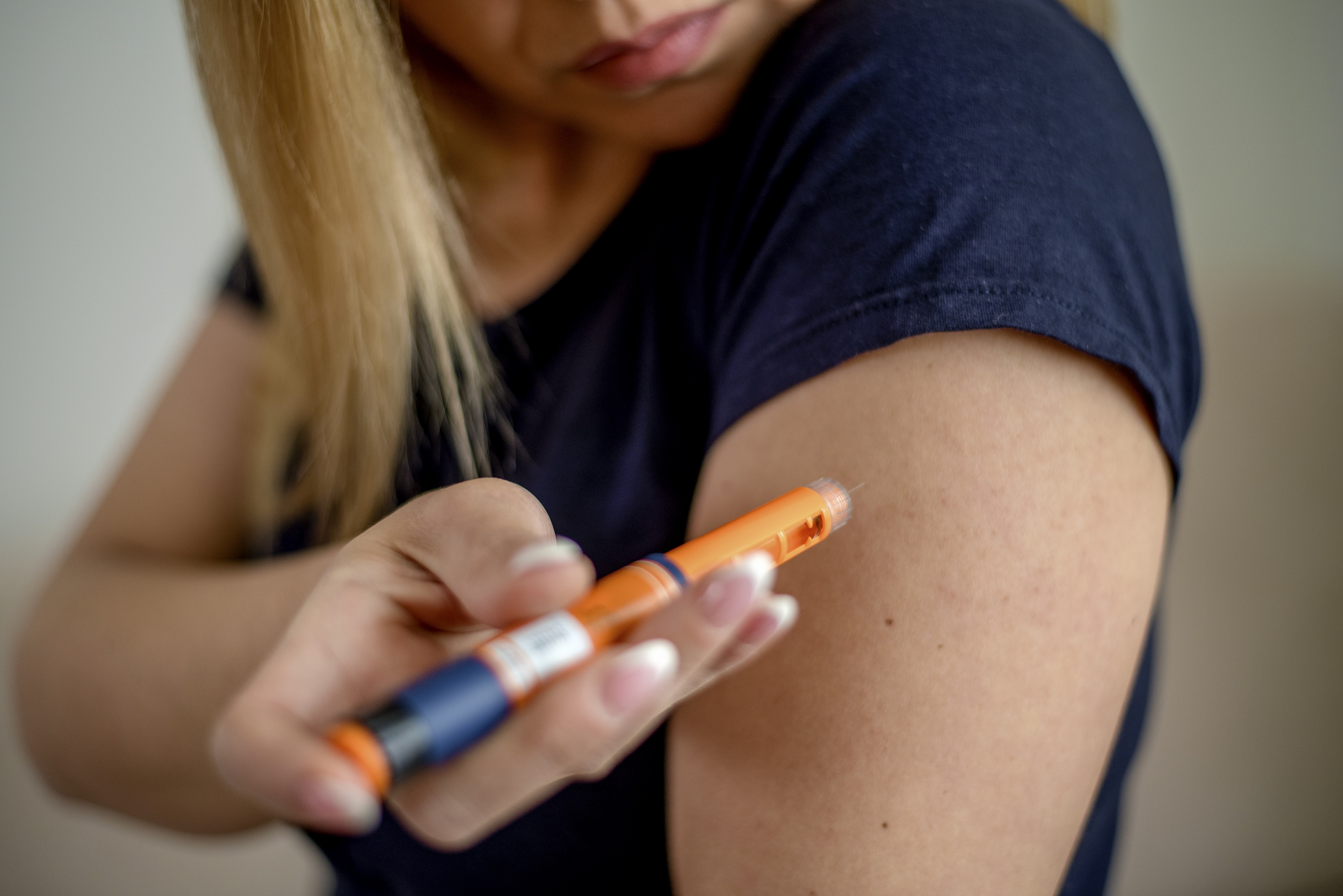 Diabetes woman with pen syringe