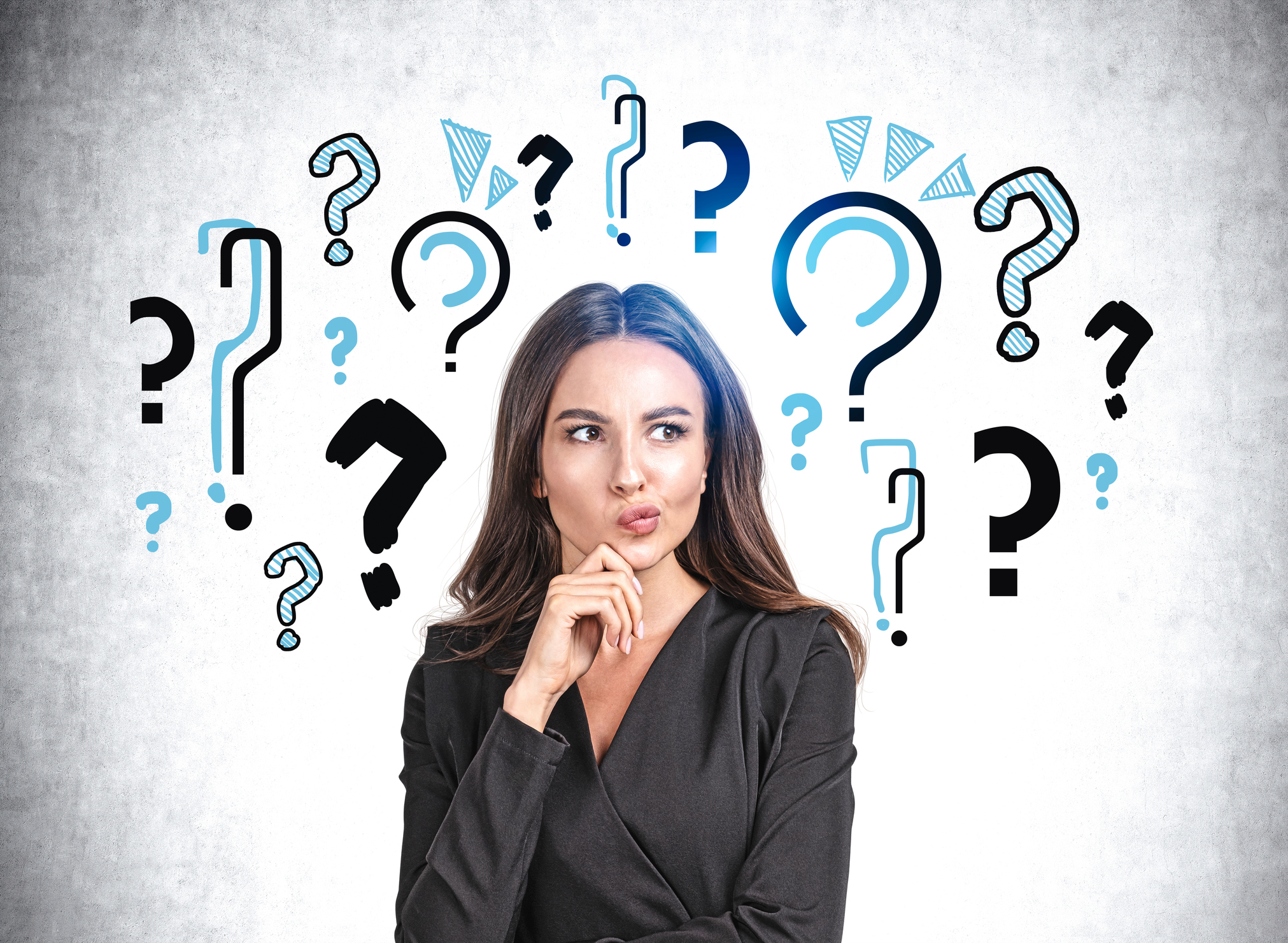 Person surrounded by question marks.
