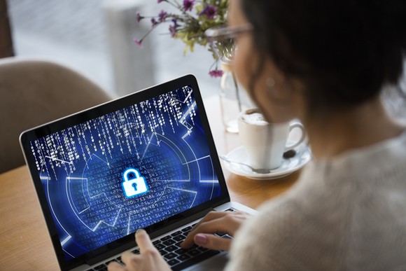 Person looking at lock on laptop screen.