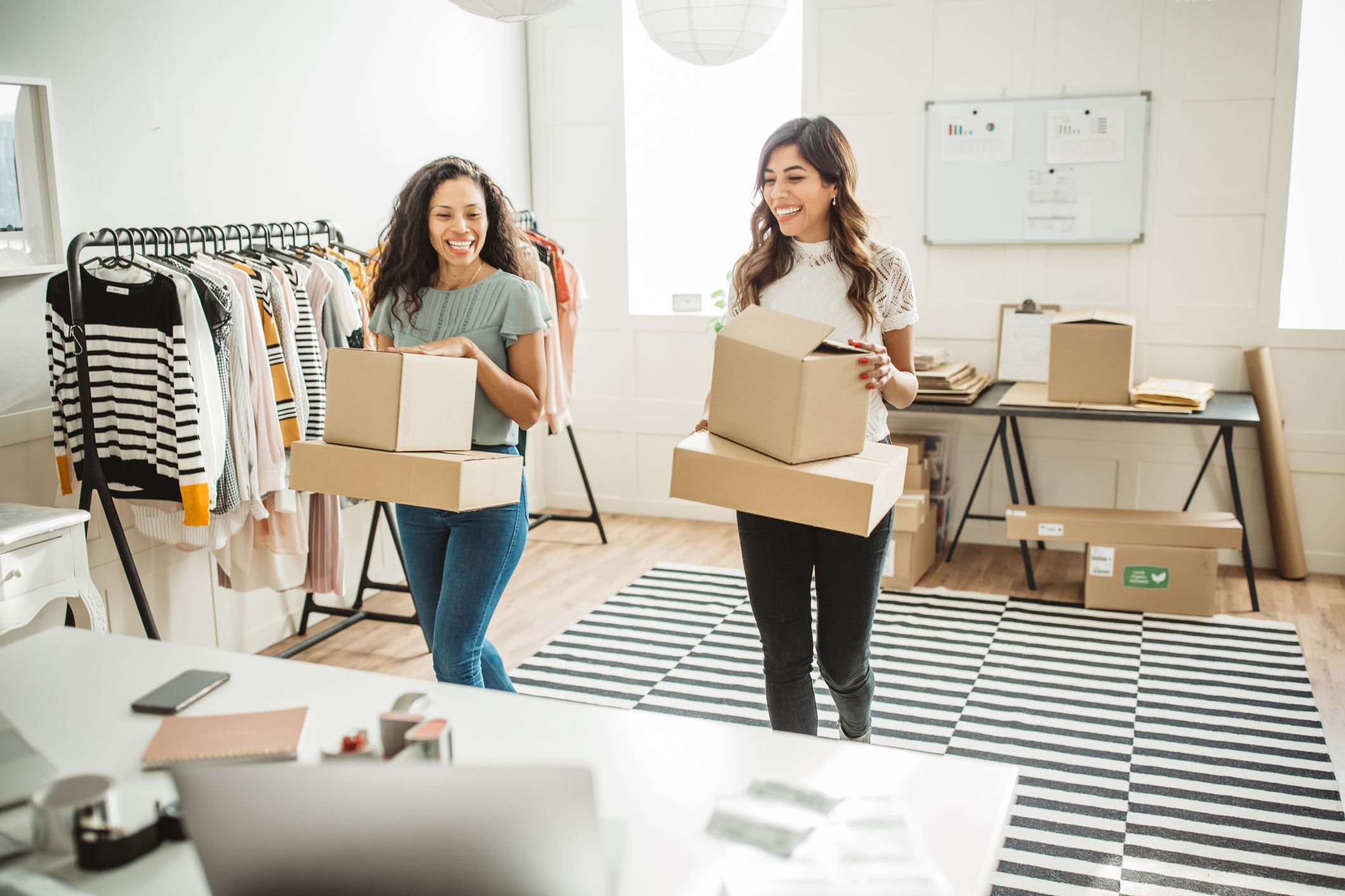 Small business owners with packages.