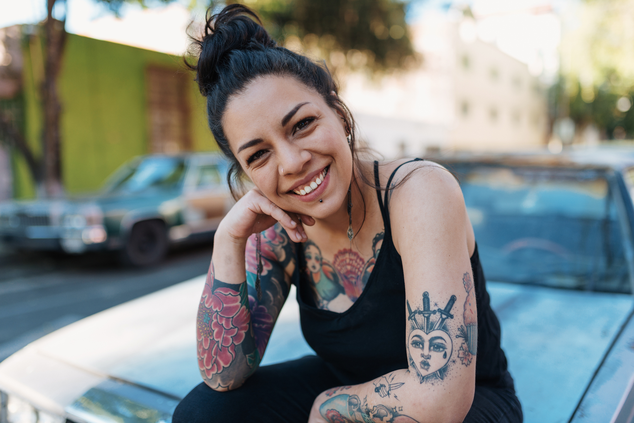 Getty - tattoos smiling happy on car