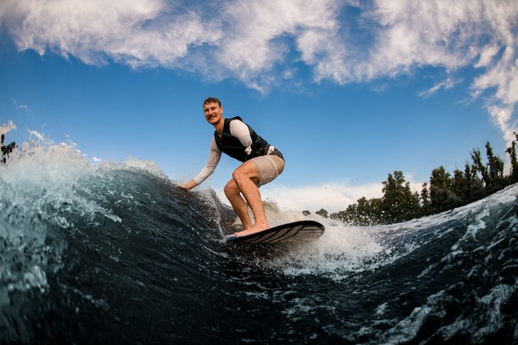 Someone is surfing and smiling. 