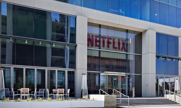 Netflix's headquarters with the Netflix logo on the front of the building. 