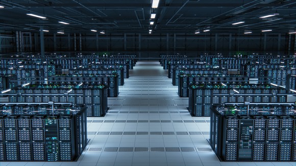 Servers lined up in a massive data center. 