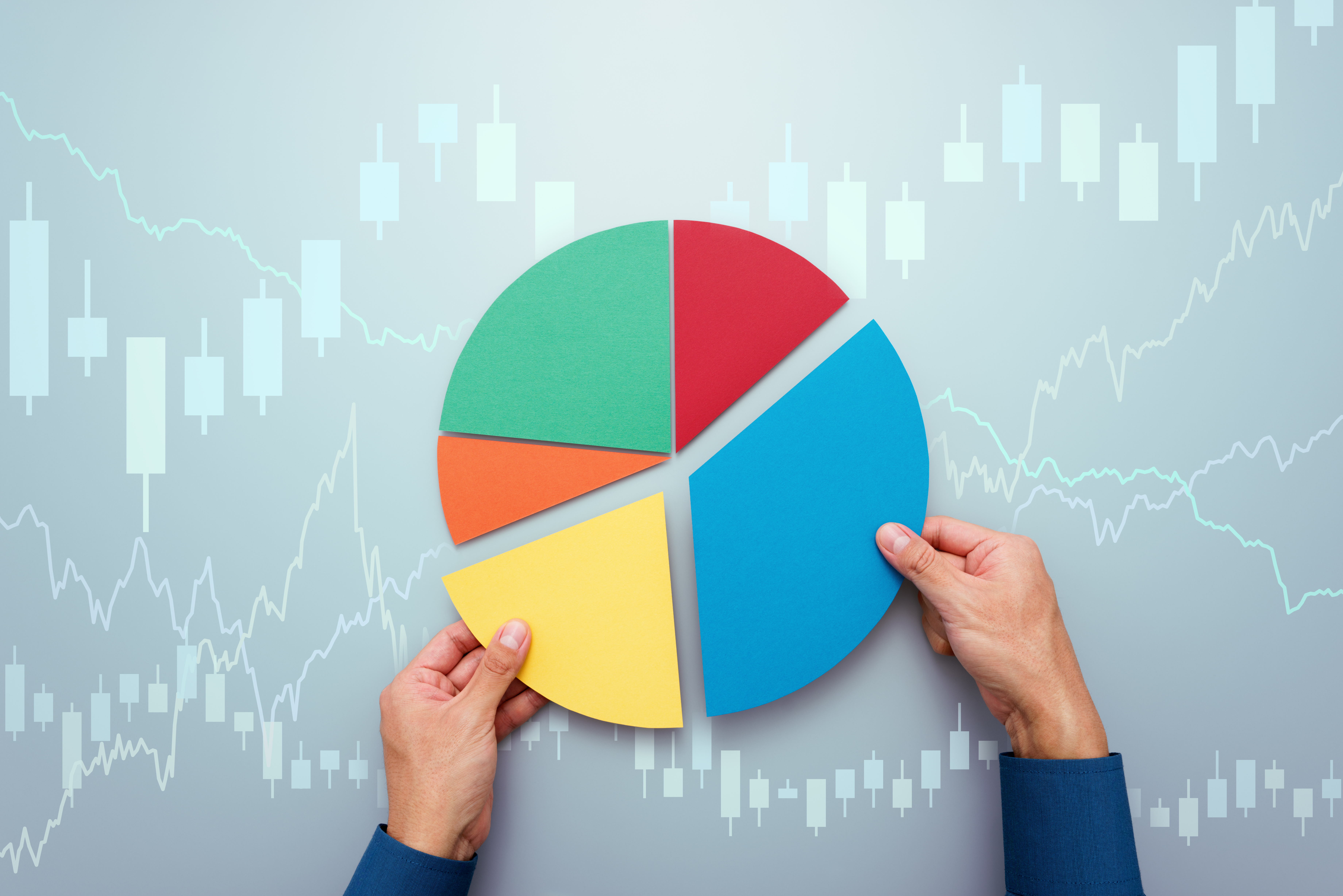 Investor assembling a multicolored pie chart.