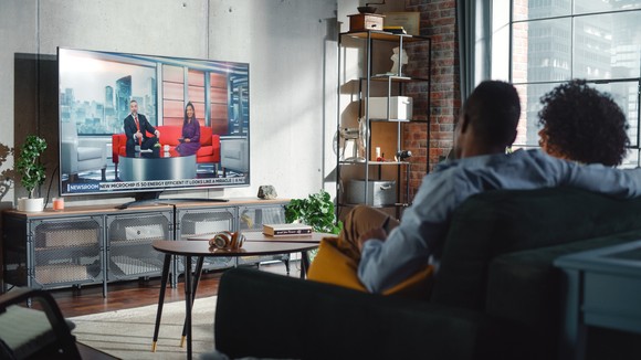 Two people watching TV.