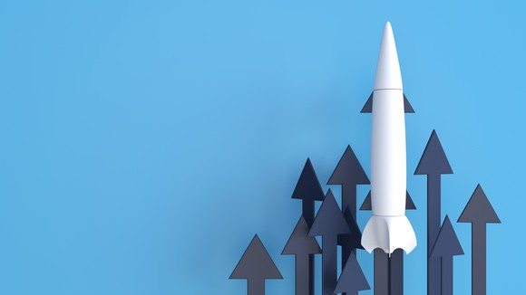 A white rocket and several black arrows pointing upward.