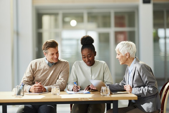 A couple meeting with an advisor.