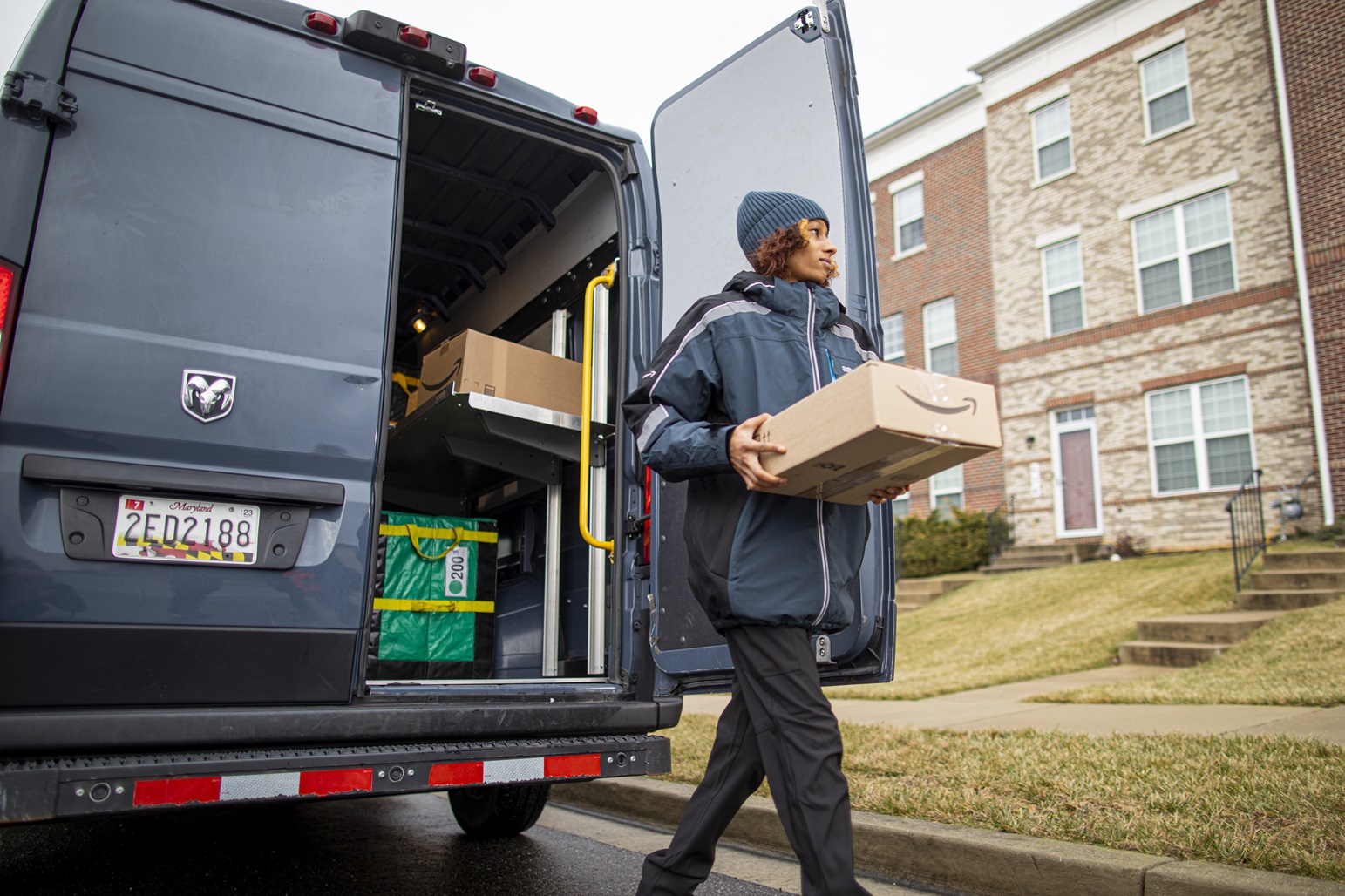 Amazon worker delivering a package.