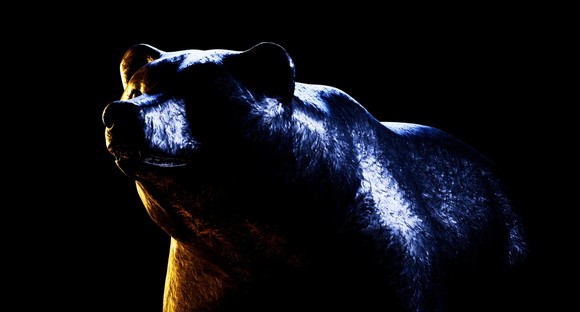 A bear statue in dramatic light.