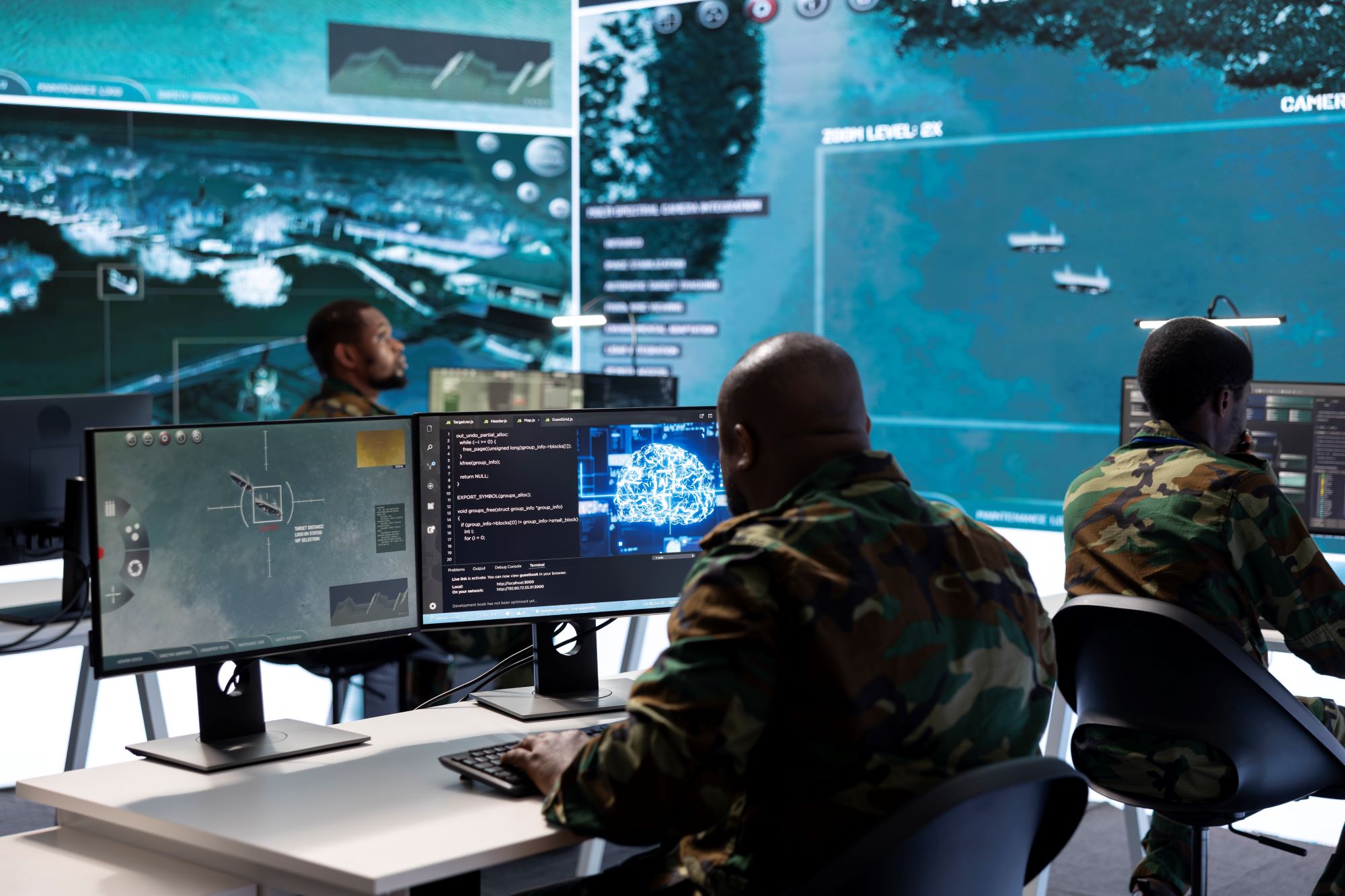 A group of people working on computers and analyzing data.