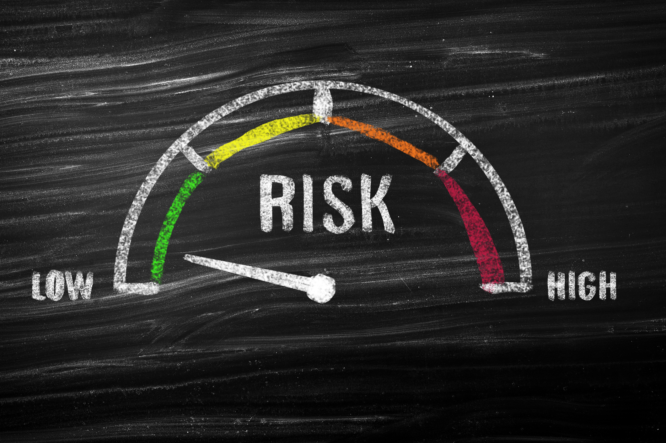 Chalkboard image of a risk meter reading "low risk".
