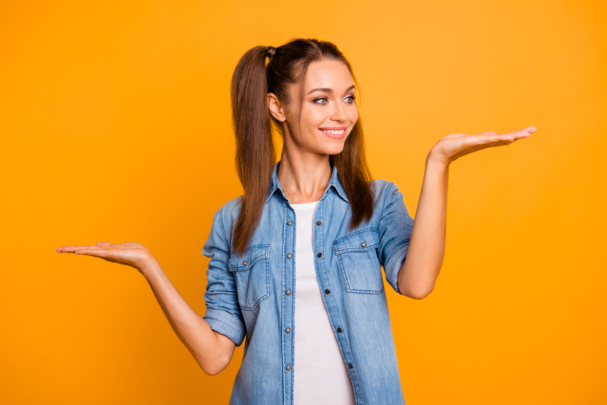 A person holding out their hands like a scale.