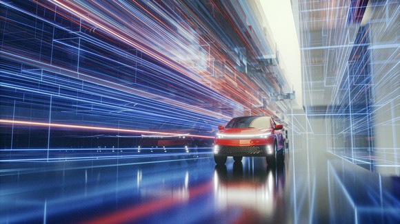 Futuristic car racing through lights. 