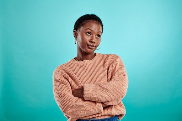 Unimpressed person with arms folded.