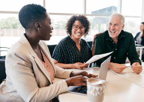 A couple talks with an advisor.