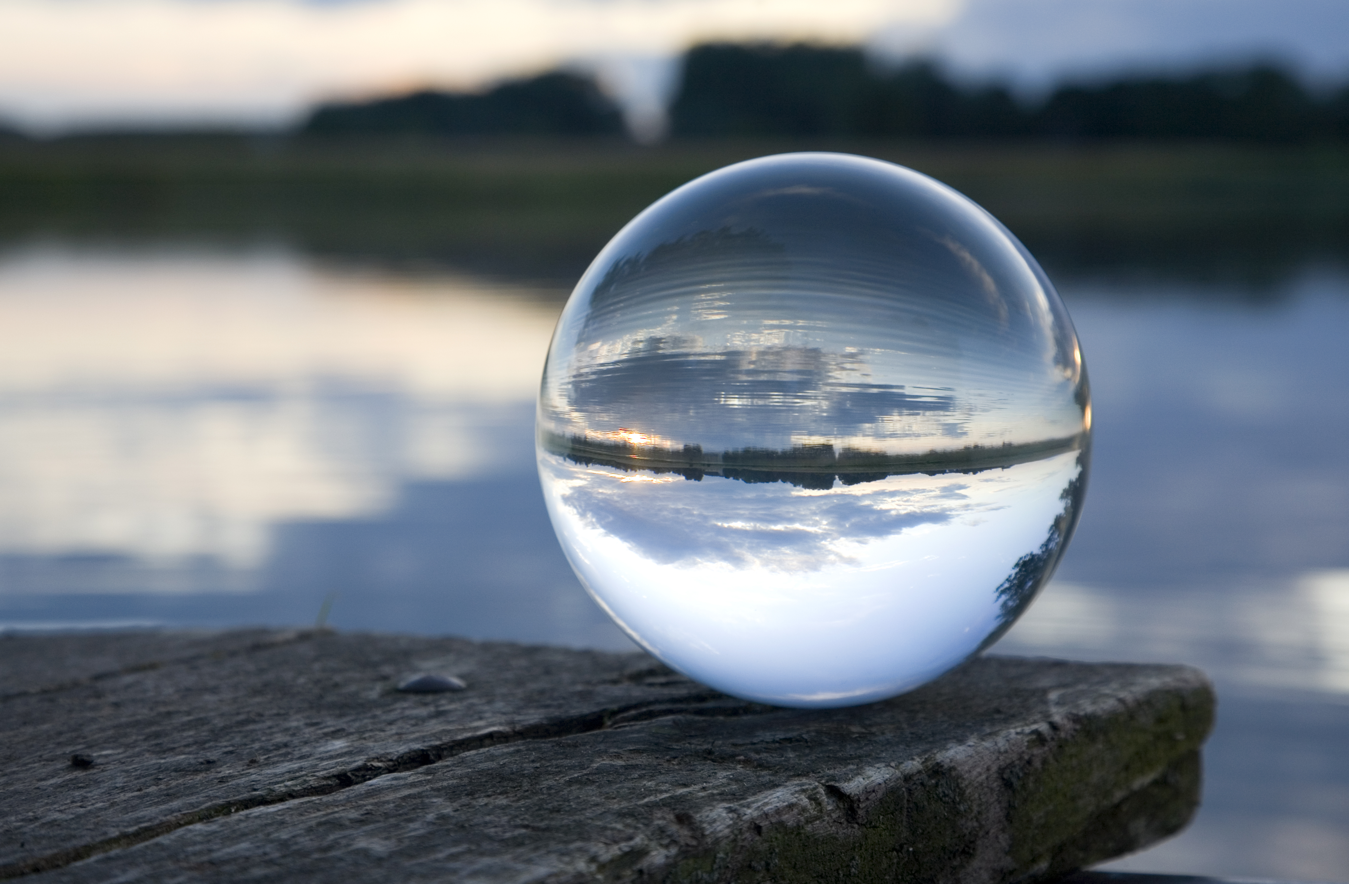 A crystal ball resting on a table.