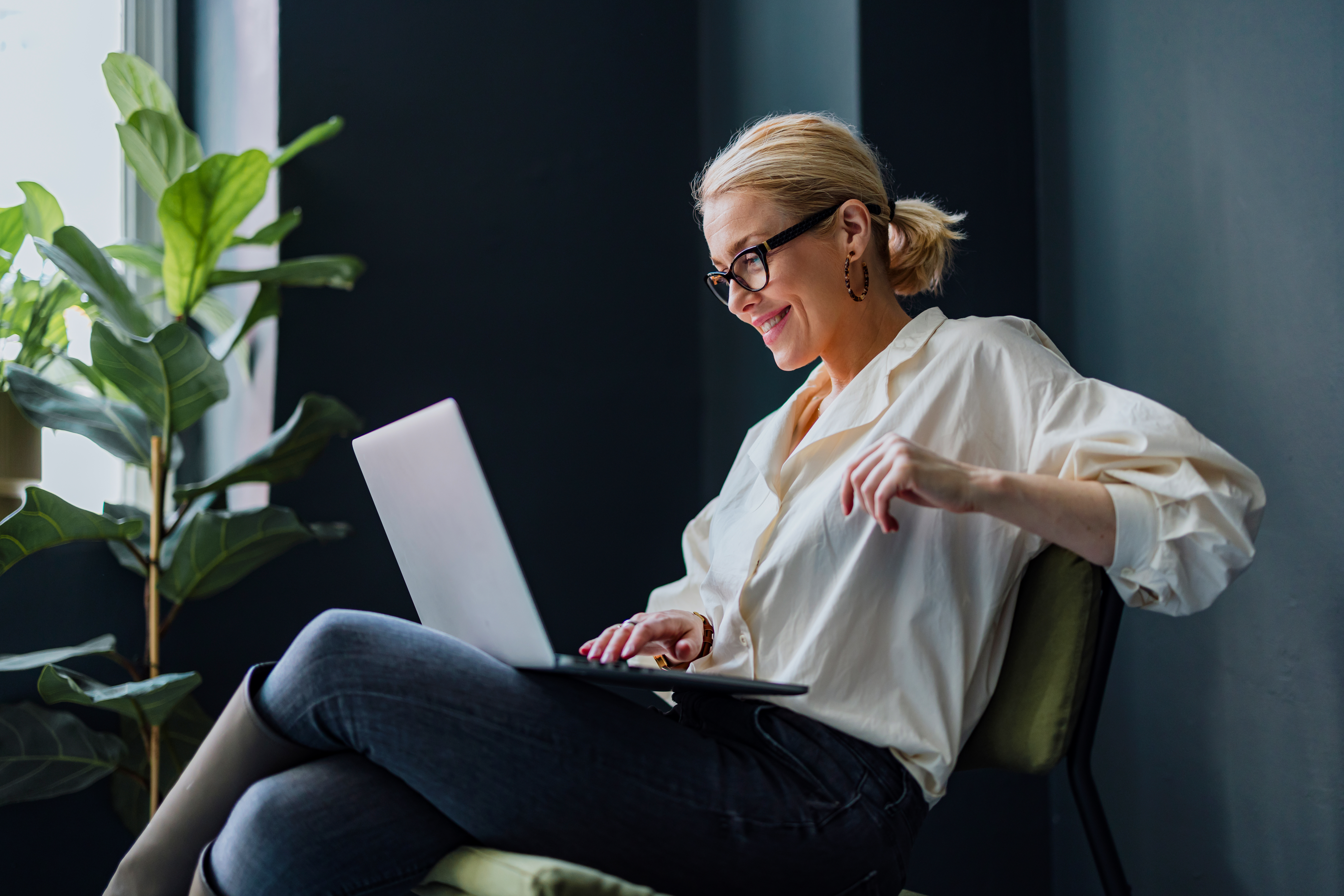 A person with a laptop in their lap.