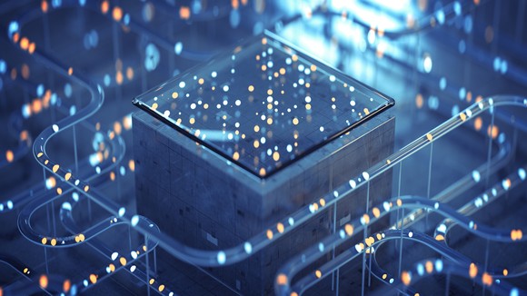 Abstract design of a computer chip on a block surrounded by tubes of light.