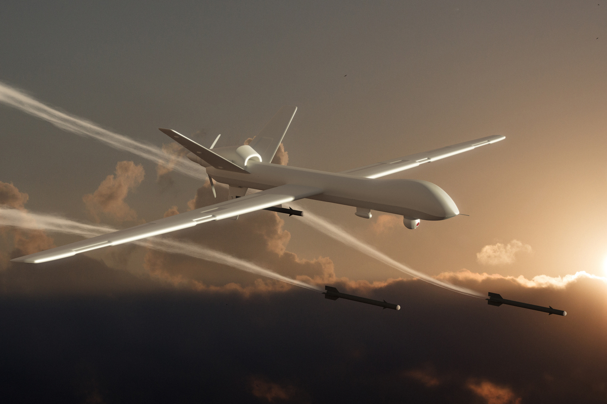 A drone fires missiles in the sky. 