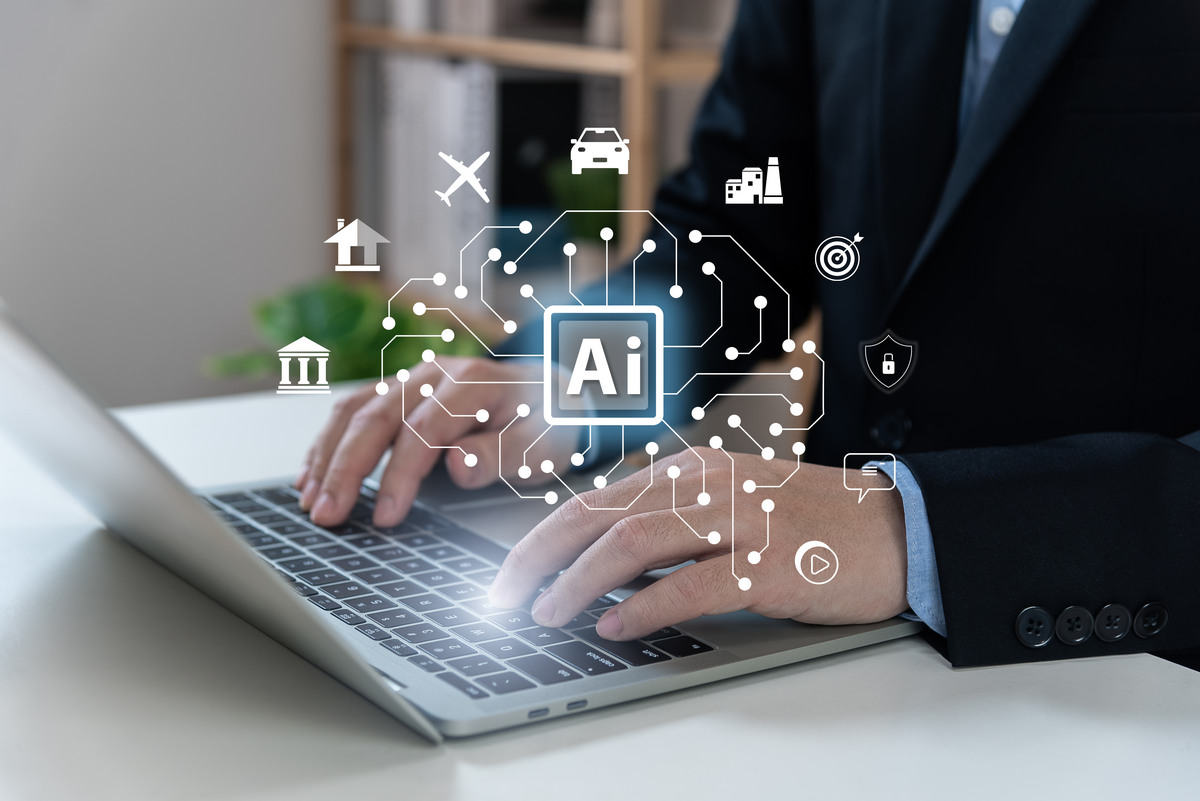 AI technology assisting a person with tasks on a laptop