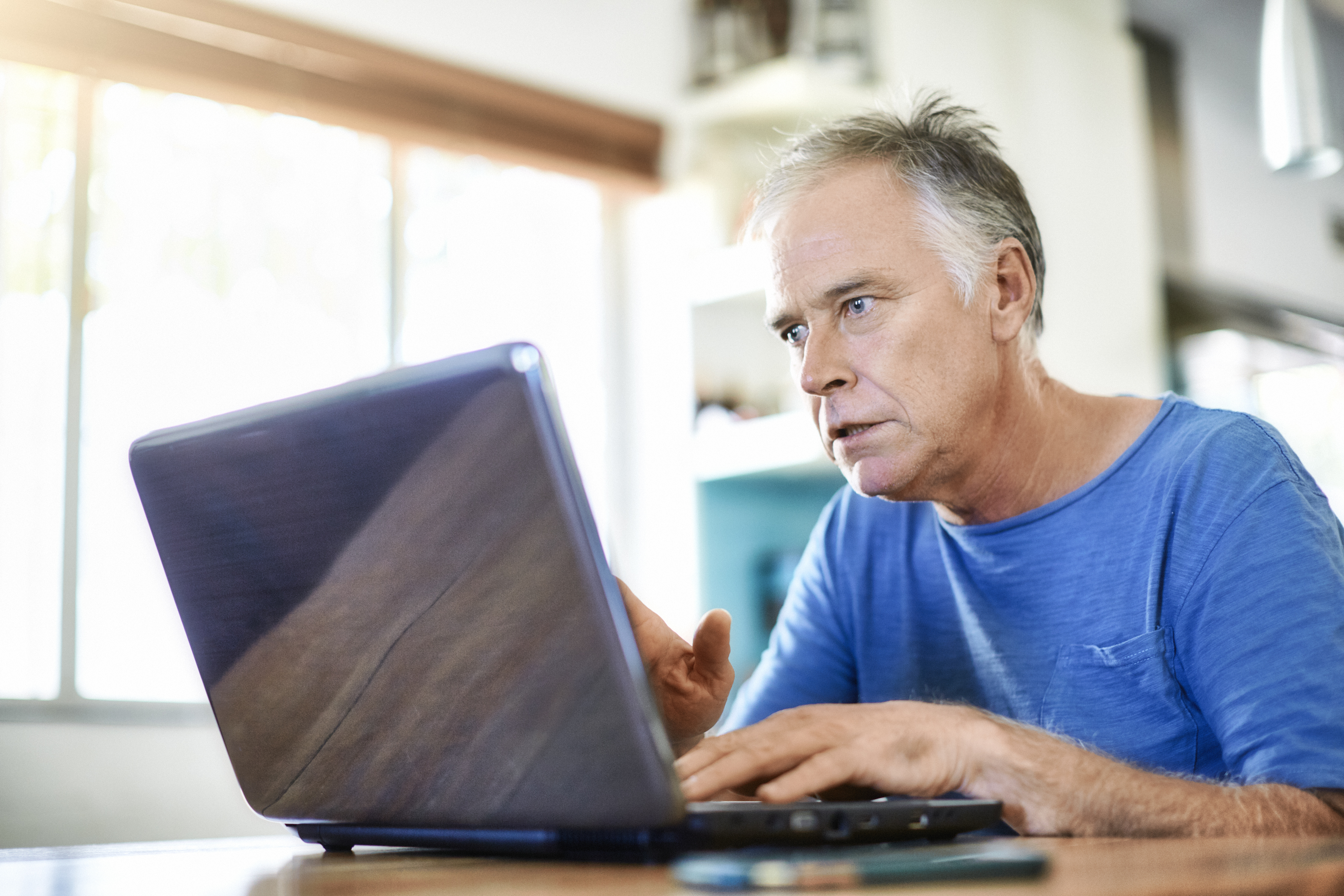 A person looking at a laptop.