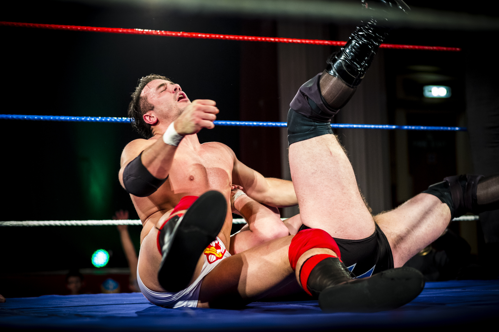 Two pro wrestlers in wrestling ring