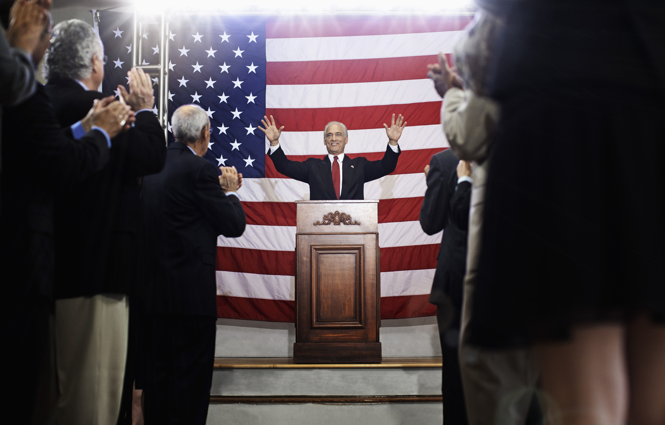A politician making a speech at a podium.